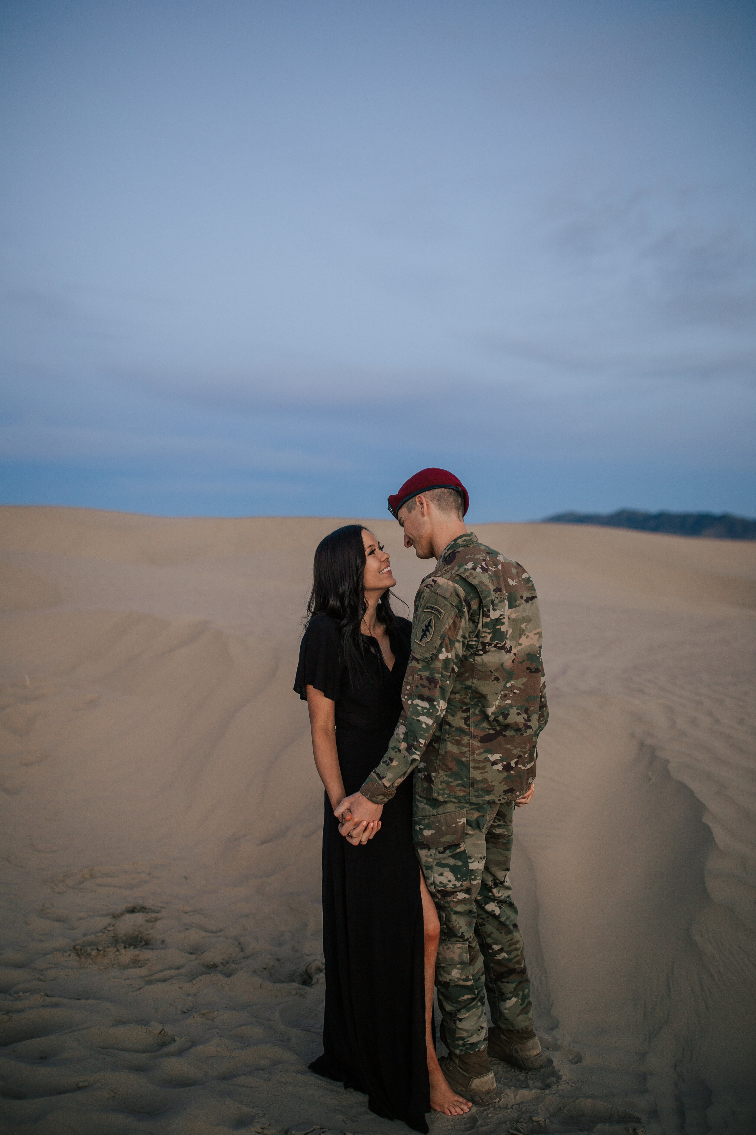Romantic Sand Dunes engagement session sun flare couple kissing couple shoot Utah desert #engagements #coupleshoot #utahphotographer #weddingphotographer Utah wedding photographer