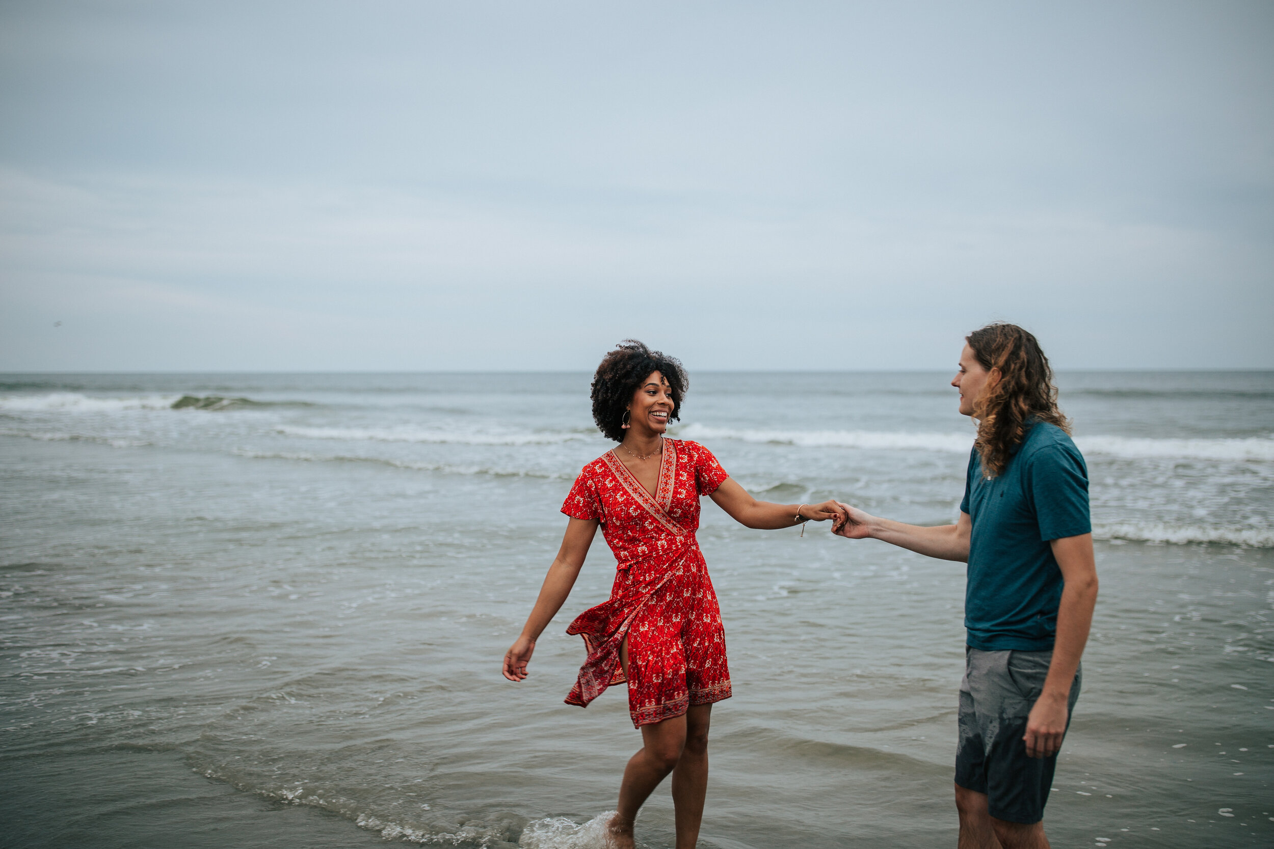 Oregon coast couples shoot engagement session Oregon engagement photographer Oregon wedding photographer elopement photographer couples shoot on the beach in water adventurous