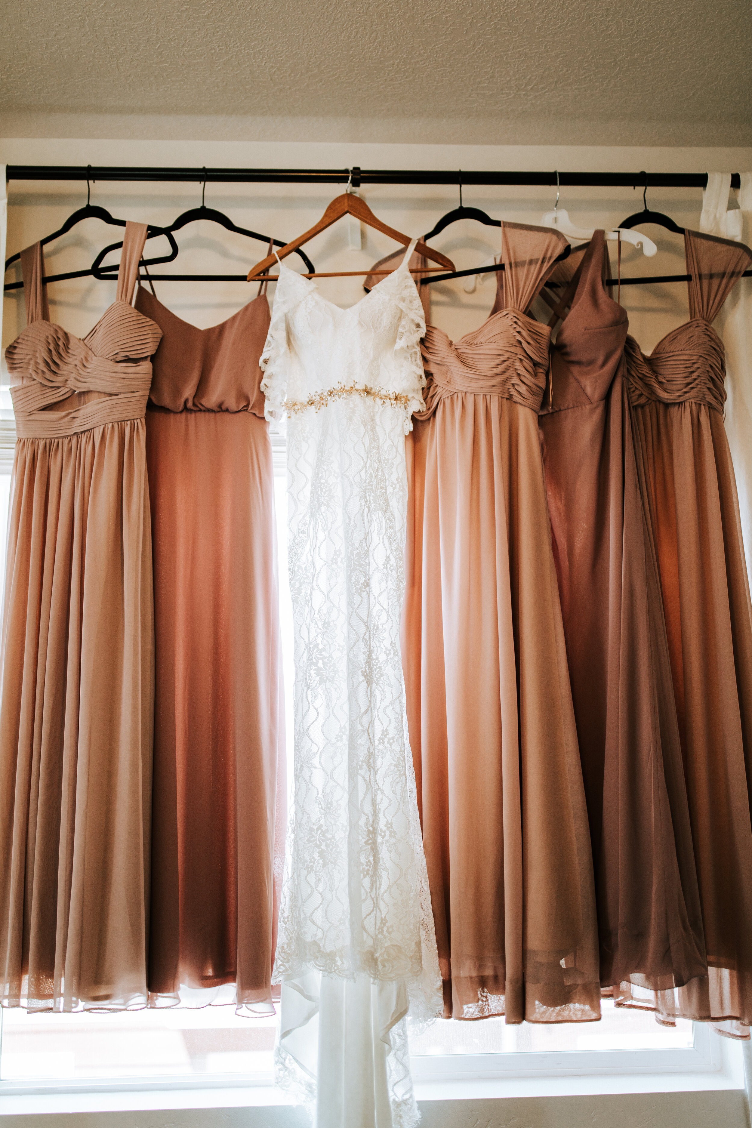 Bride and bridesmaids dresses hung up Utah wedding photographer