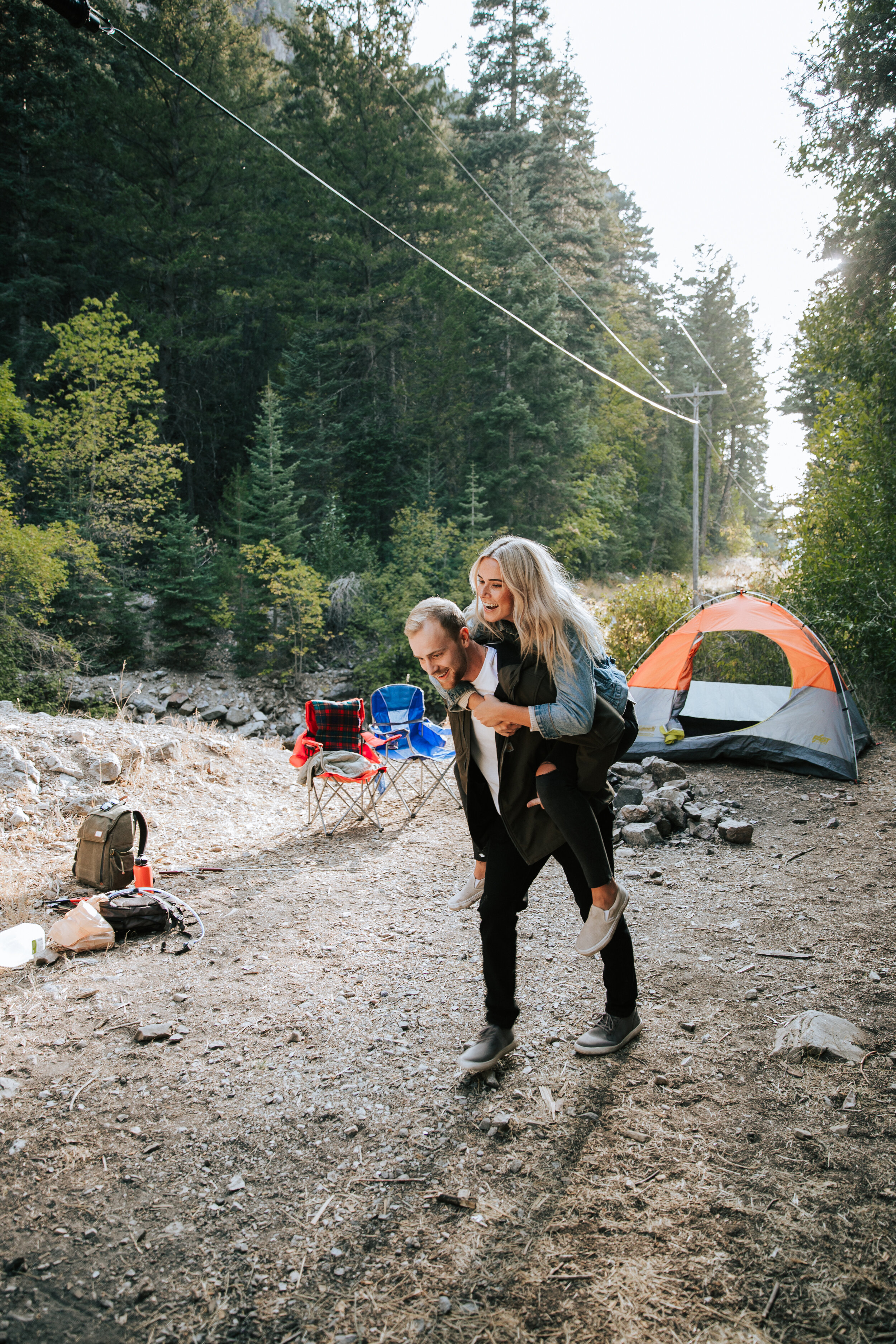 Adventure couples shoot camping in the mountains forest engagements Utah engagement photographer Utah couples photographer Oregon photographer PNW campfire tent