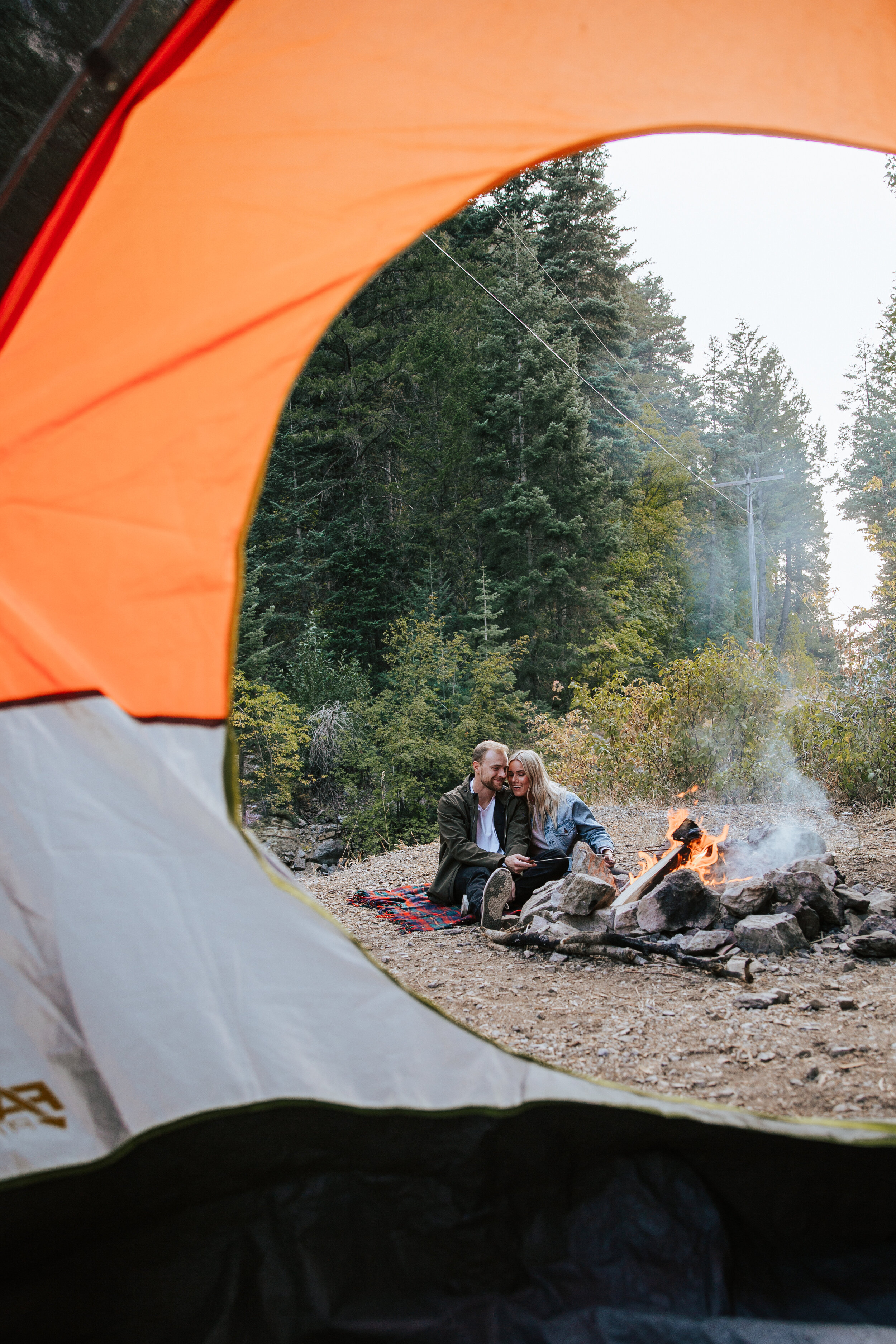 Adventure couples shoot camping in the mountains forest engagements Utah engagement photographer Utah couples photographer Oregon photographer PNW campfire tent