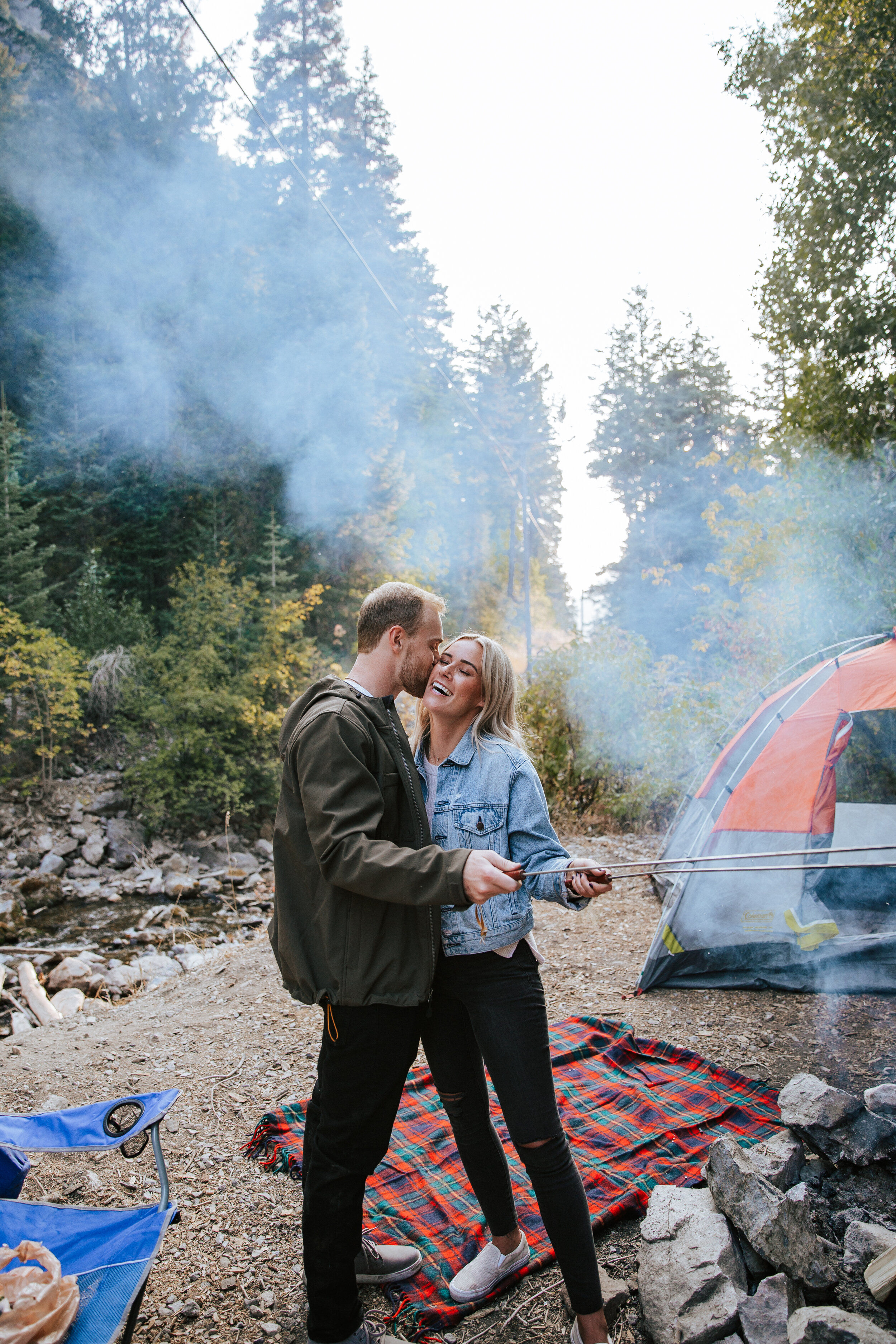 Adventure couples shoot camping in the mountains forest engagements Utah engagement photographer Utah couples photographer Oregon photographer PNW campfire tent roasting marshmallows