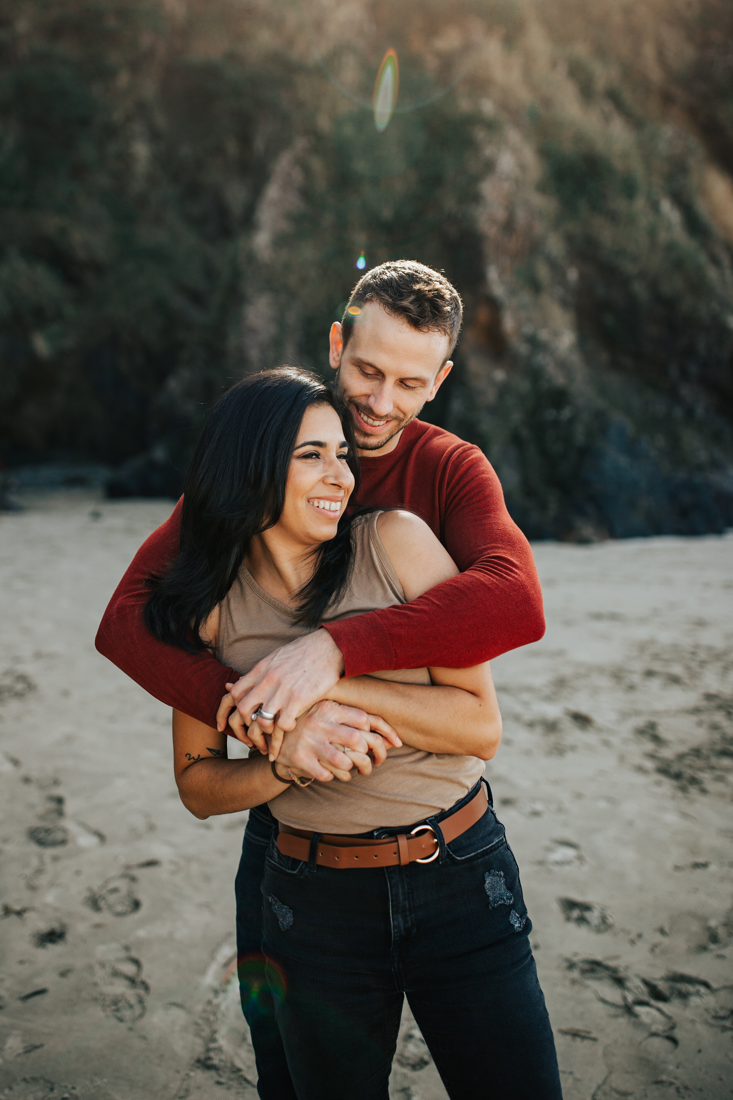 Oregon coast engagement session cute cuddling adventurous couples shoot at Hug Point in the PNW beach engagements #oregonphotographer #engagements 