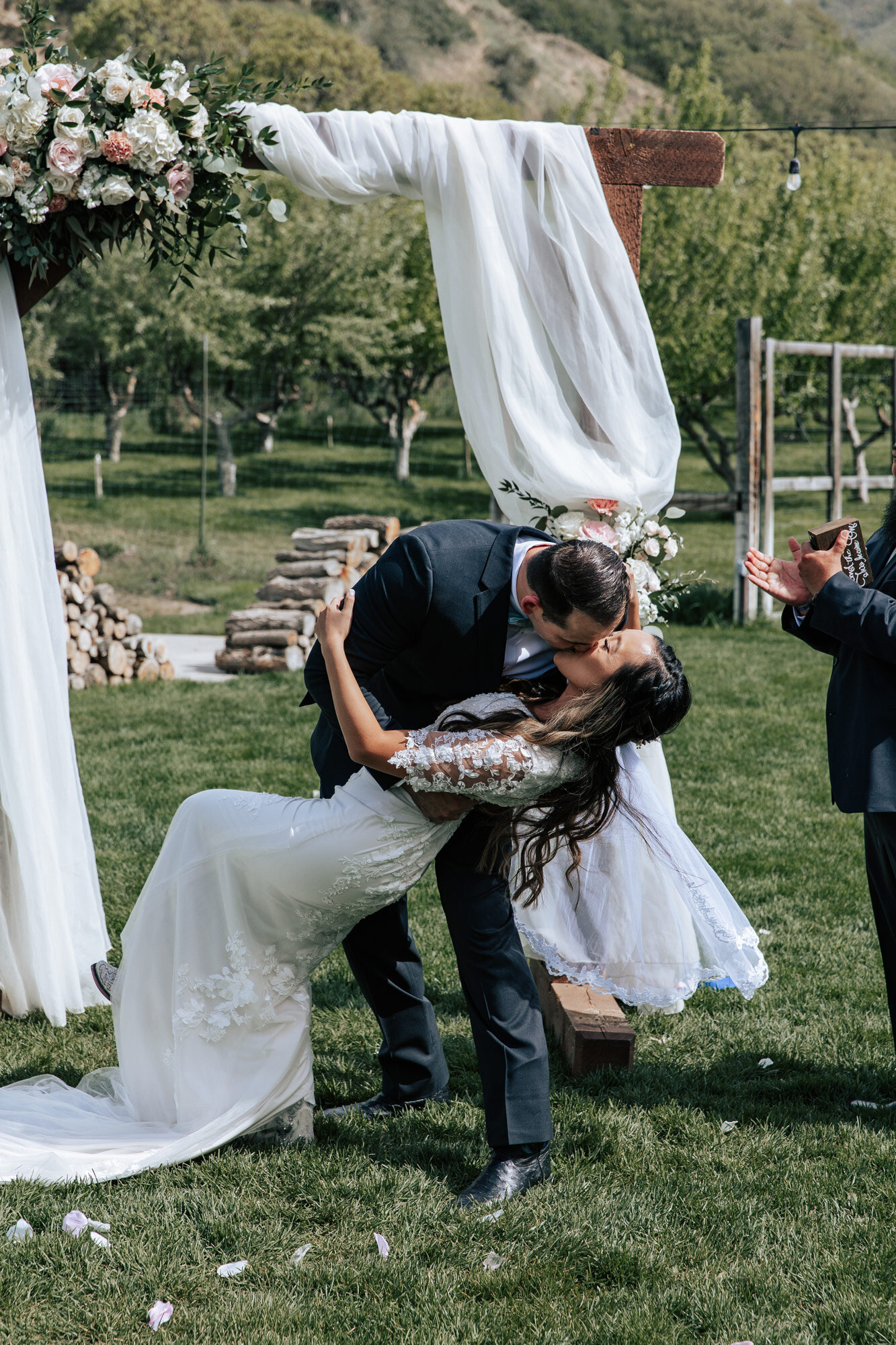  After being pronounced husband and wife a groom dips his wife and kisses her by Emily Jenkins Photography at Quiet Meadow Farms in Utah. you may now kiss the bride dip kiss picture husband and wife #emilyjenkinsphotography #emilyjenkinsweddings #uta