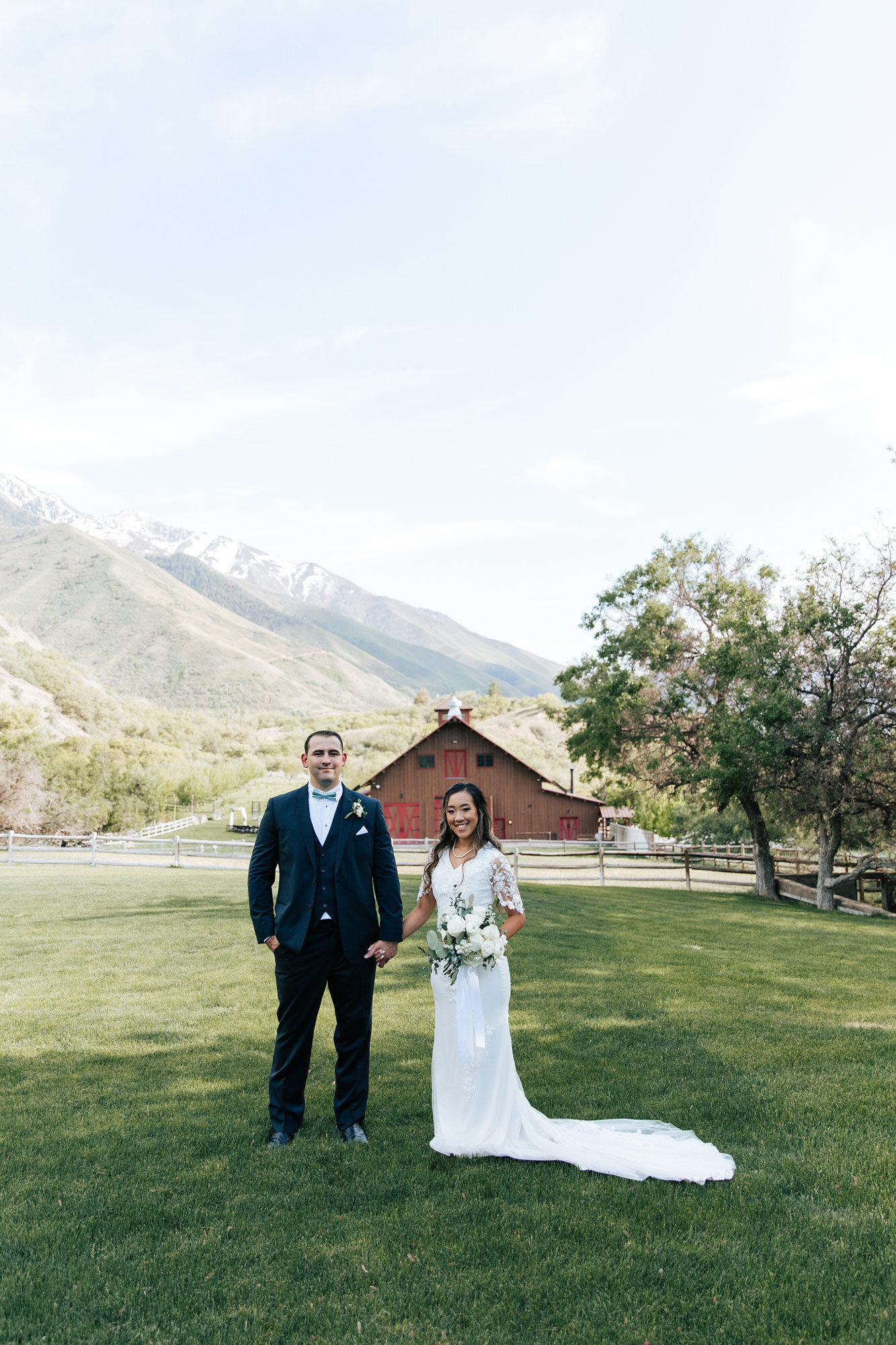  Stunning wedding portraits of a couple in the country in front of a barn with clear blue sky at Quiet Meadow Farms by Emily Jenkins Photography. country wedding portraits cowboy and cowgirl bridals #emilyjenkinsphotography #emilyjenkinsweddings #uta