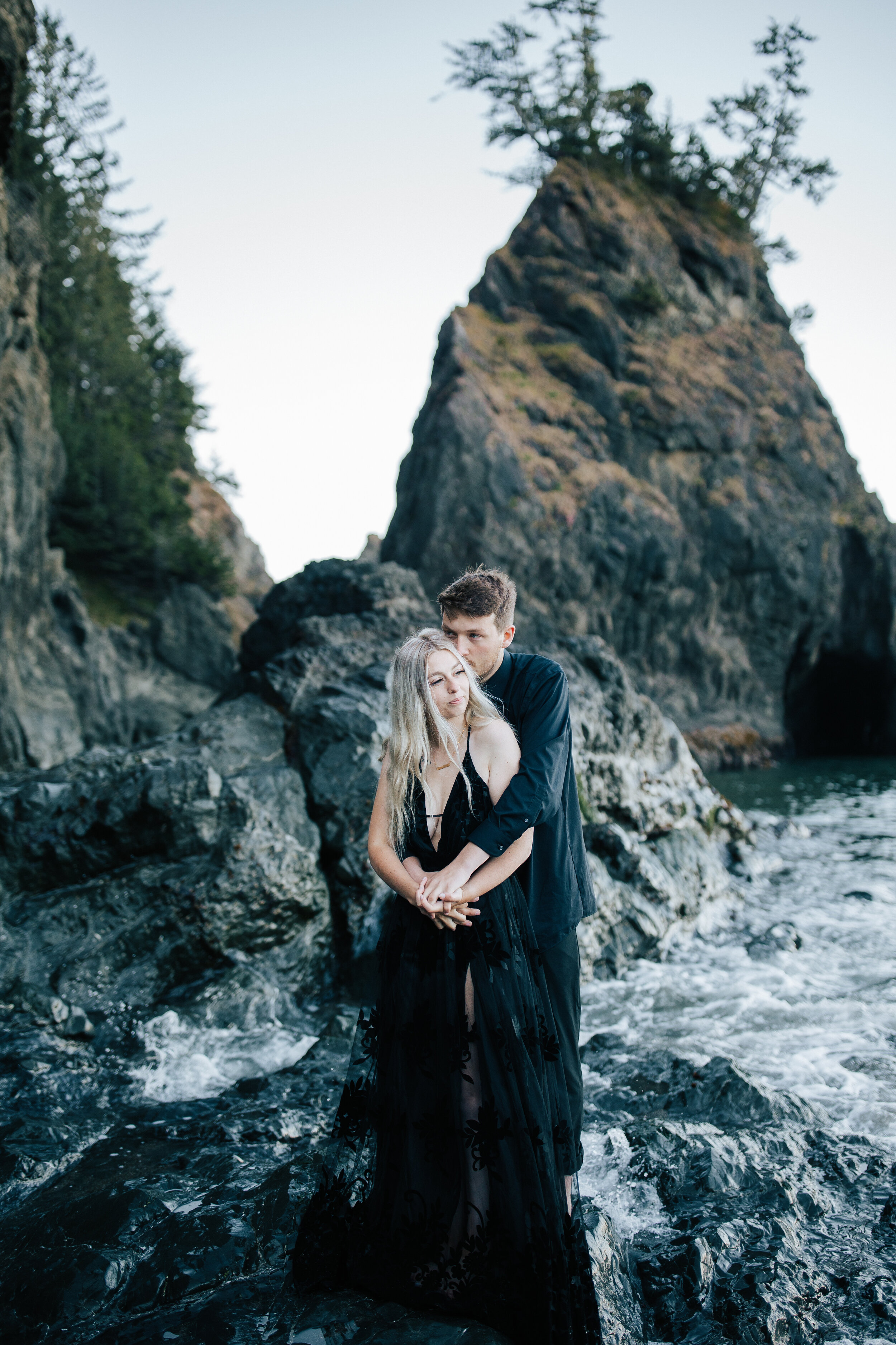  Samuel H Boardman Scenic Corridor southern Oregon coast elopement bride and groom saying their vows on a cliff on the Oregon coast with sea stacks and the ocean below black bridal gown couple in all black a groom walks with his new bride #oregonphot