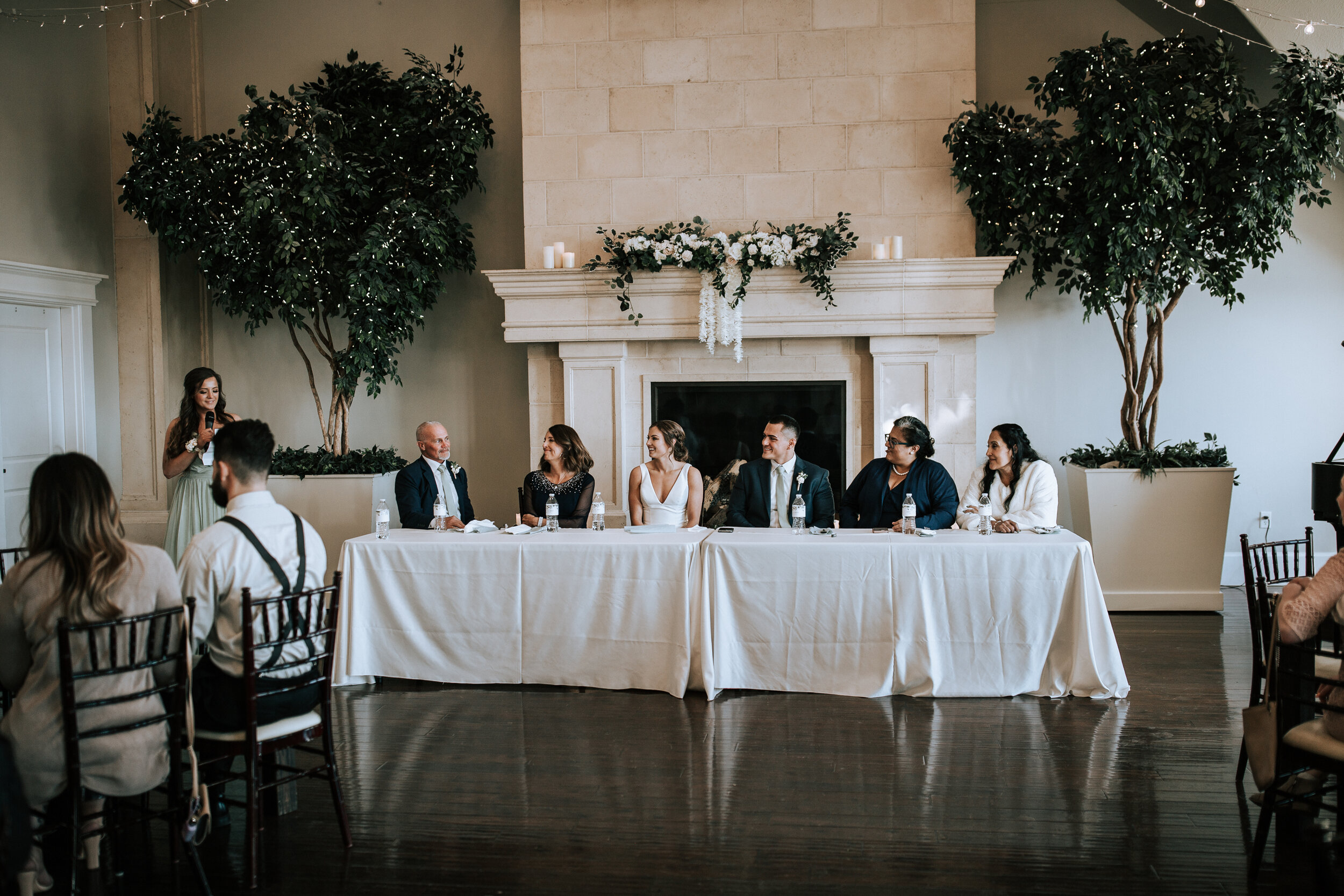  Emily Jenkins Photography captures a picture of the head table and their faces as the speaker talks about the darling couple at Sleepy Ridge Golf Course. head table speech photo Utah county wedding venues classy weddings #emilyjenkinsphotography #em