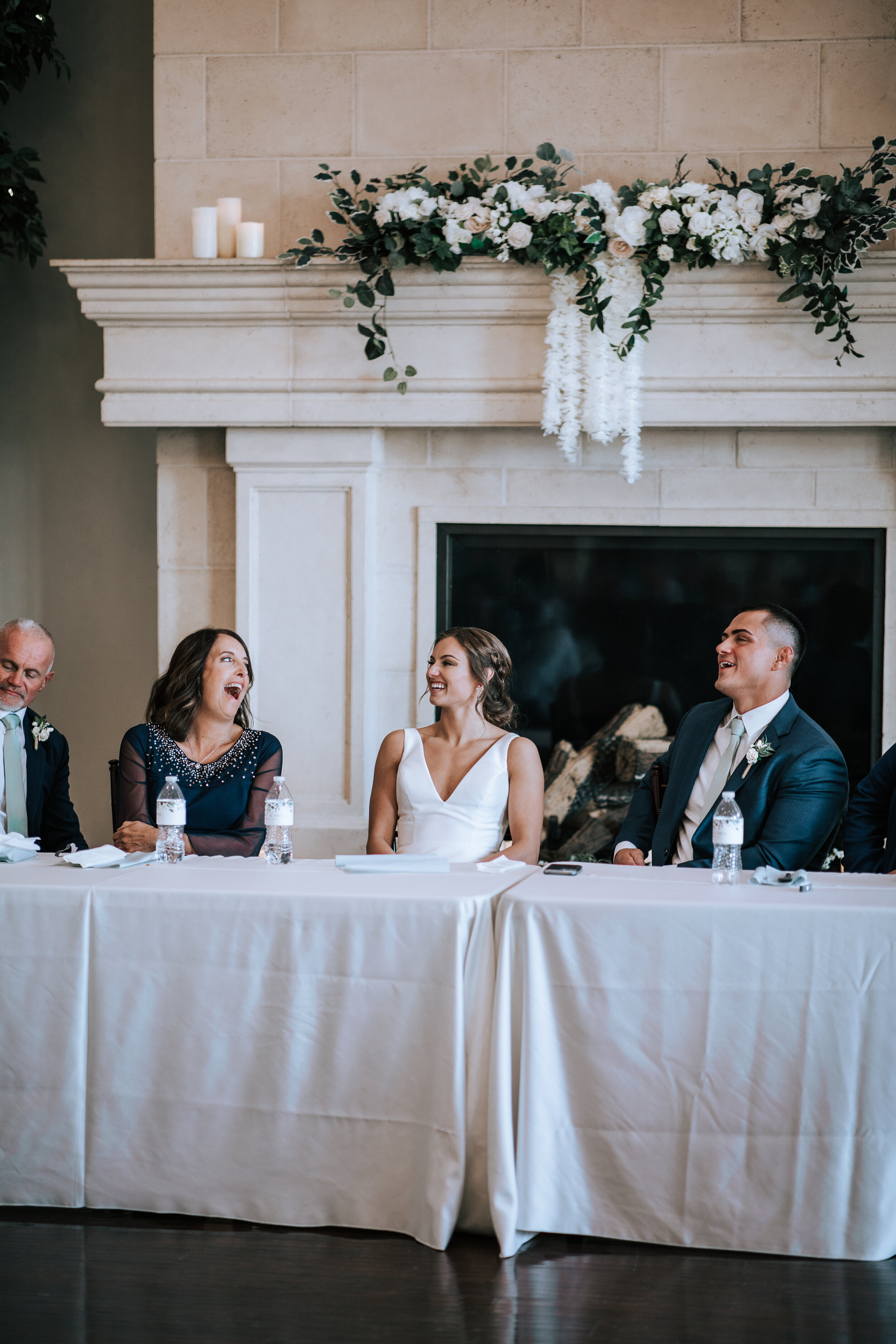  Emily Jenkins Photography captures a fun photo of the mother of the bride laughing while sitting at the head table at Sleepy Ridge in Utah County. mother of the bride luncheon photos central Utah weddings #emilyjenkinsphotography #emilyjenkinsweddin