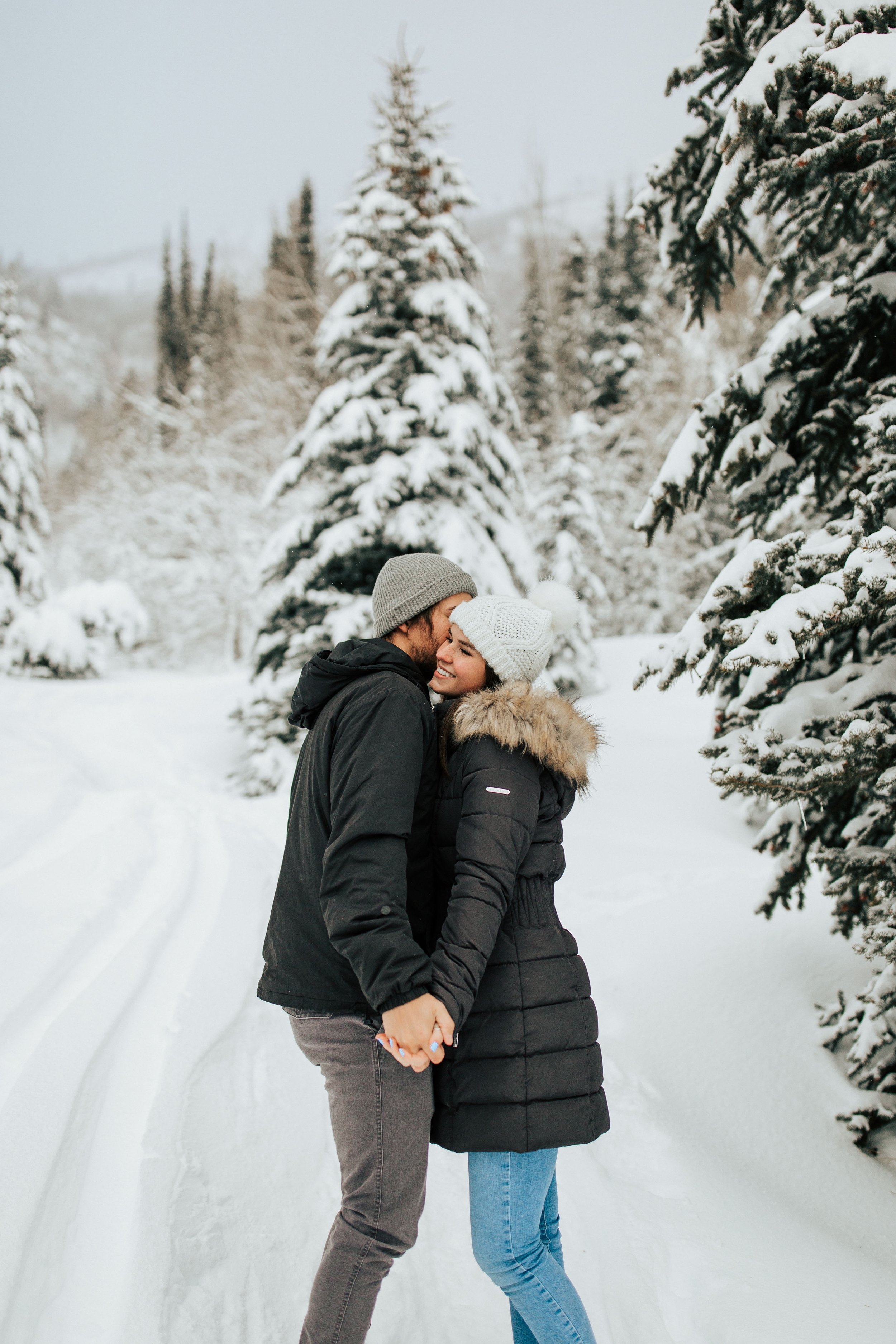  Winter photoshoot outfit inspo coats and beanies couples session couple playing in the snow winter engagement session #winteroutfitinspo #outfitinspo #winteroutfits #winterphotoshoot  