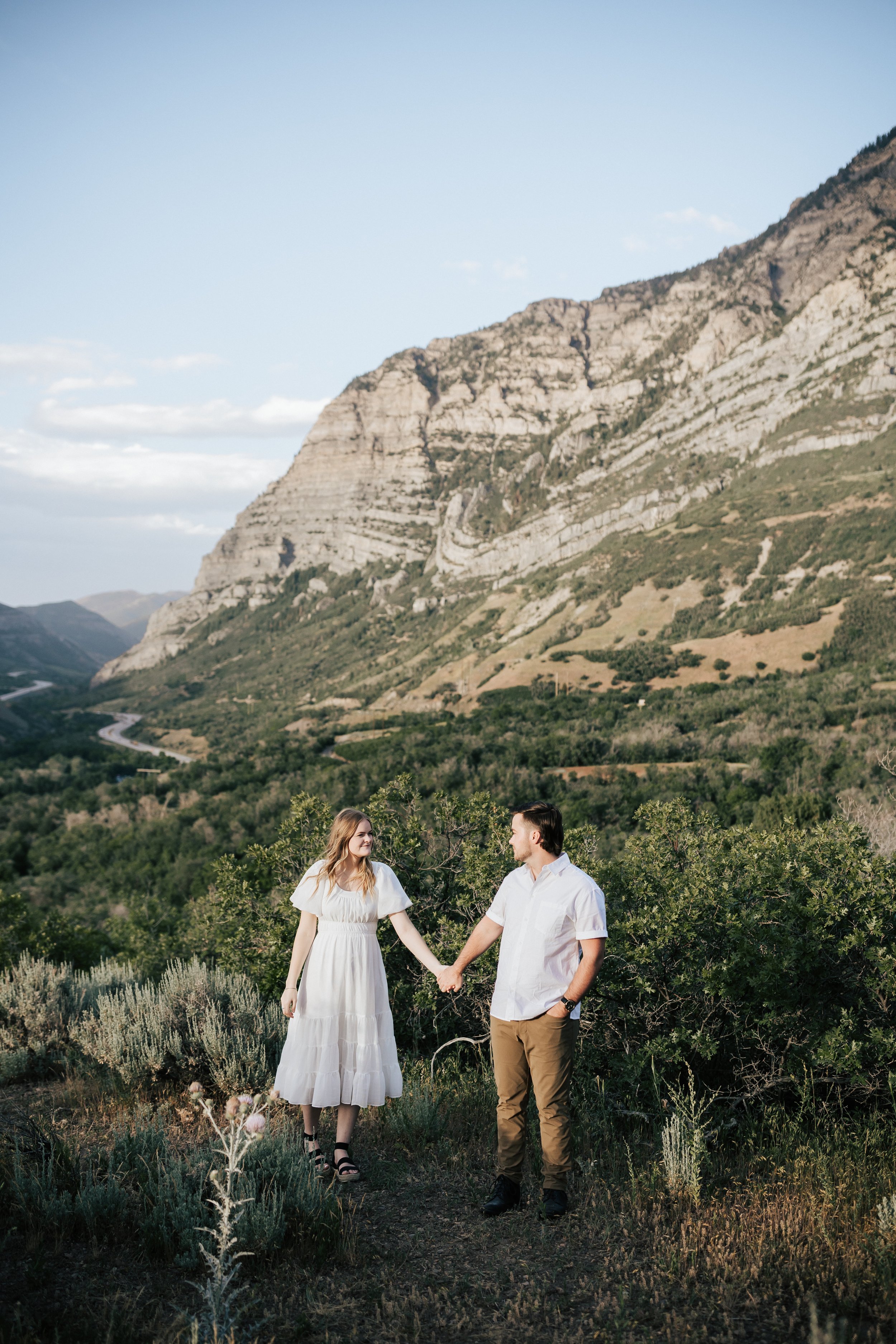  Summer anniversary couples session in the mountains. A young couple walks around the mountains. Utah photographer. Engagement session. #utahphotographer #utahengagements  