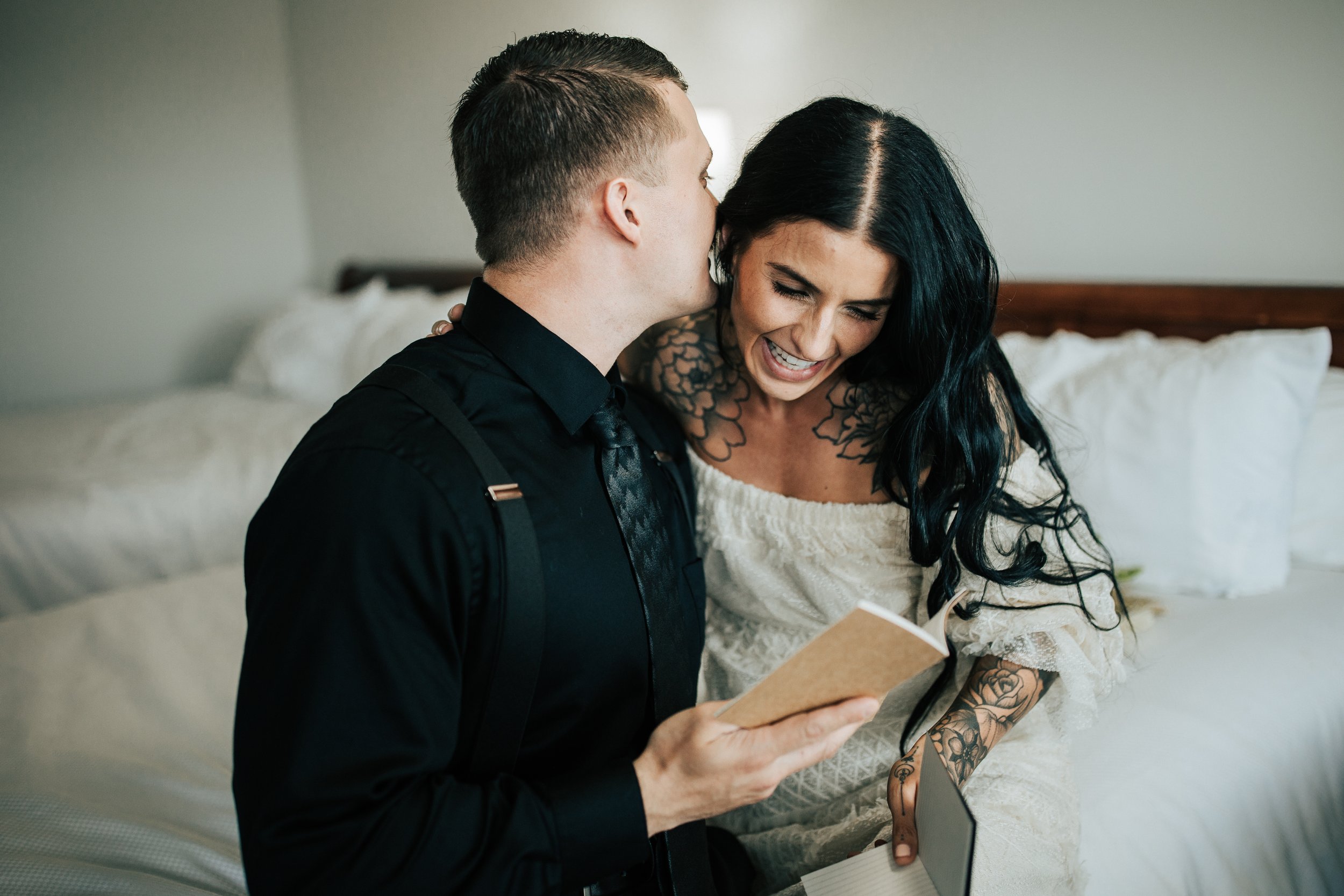  Oregon coast elopement. Couple elopes on the beach with the sun shining behind them. Sun rays behind rocks. Beach with rocks and haystacks. Southern Oregon. Couples gets ready together in hotel room. Getting ready photos. #elopement #photography 