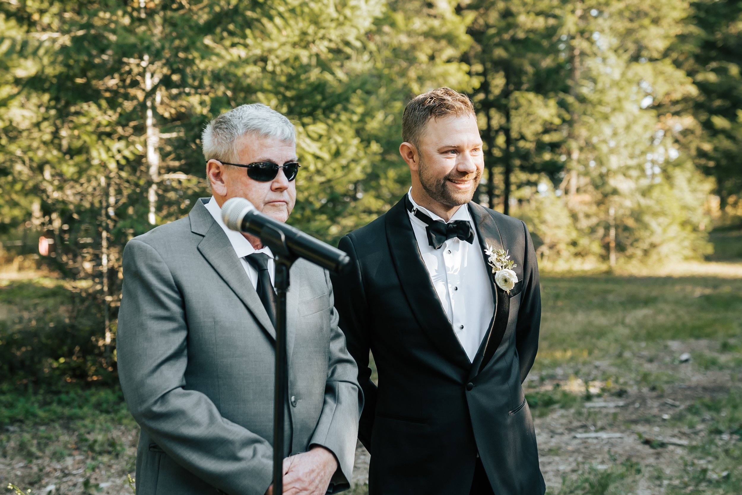  Groom smiles as he watches his bride walking down the aisle. #groom #montanawedding 