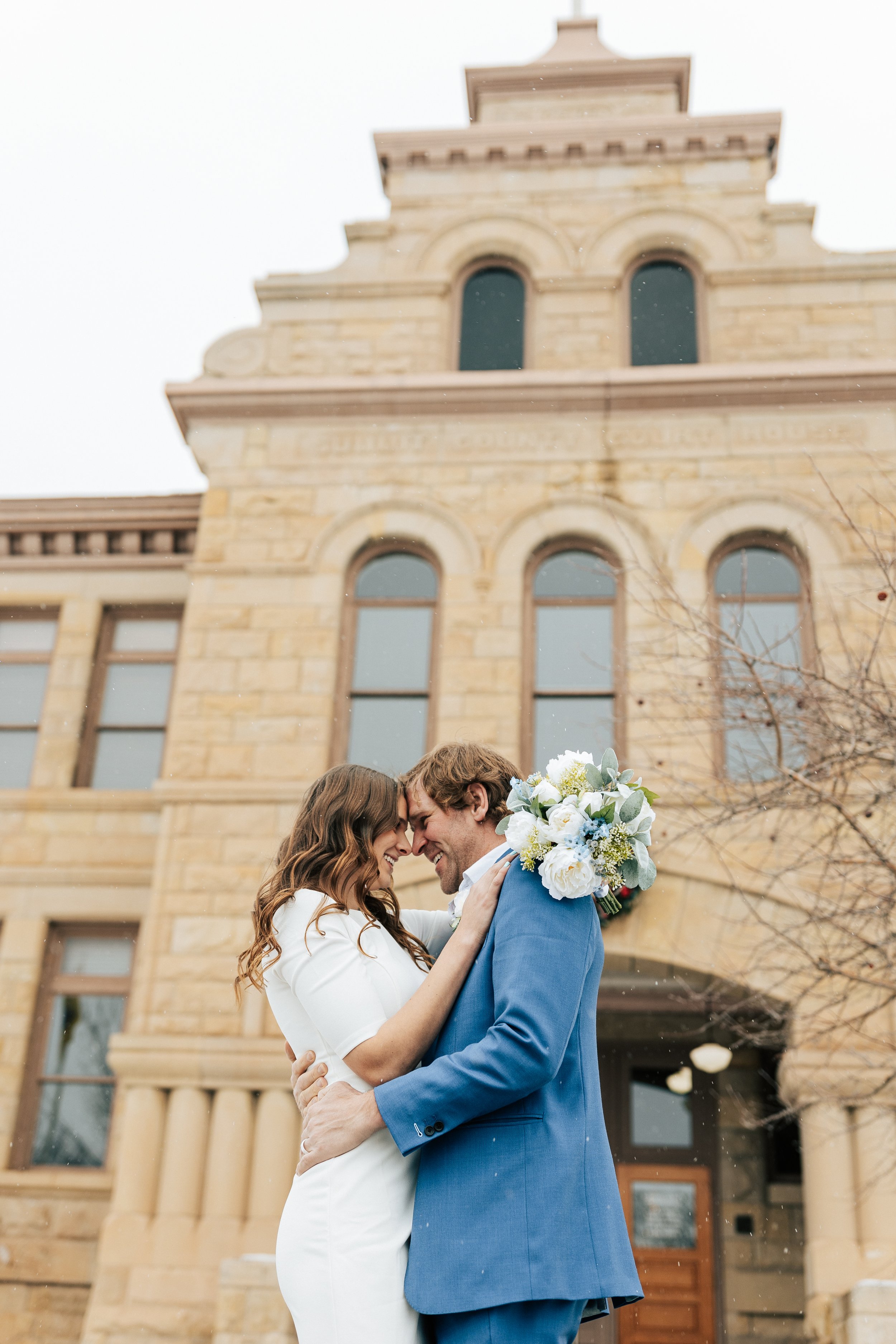  If you're looking for a sign to elope in park city utah, here it is. Check out this beautiful snowy winter wedding in coalville utah at the nearest courthouse to elope in park city emily jenkins photo #elopement #parkcityutah #parkcity #parkcityelop