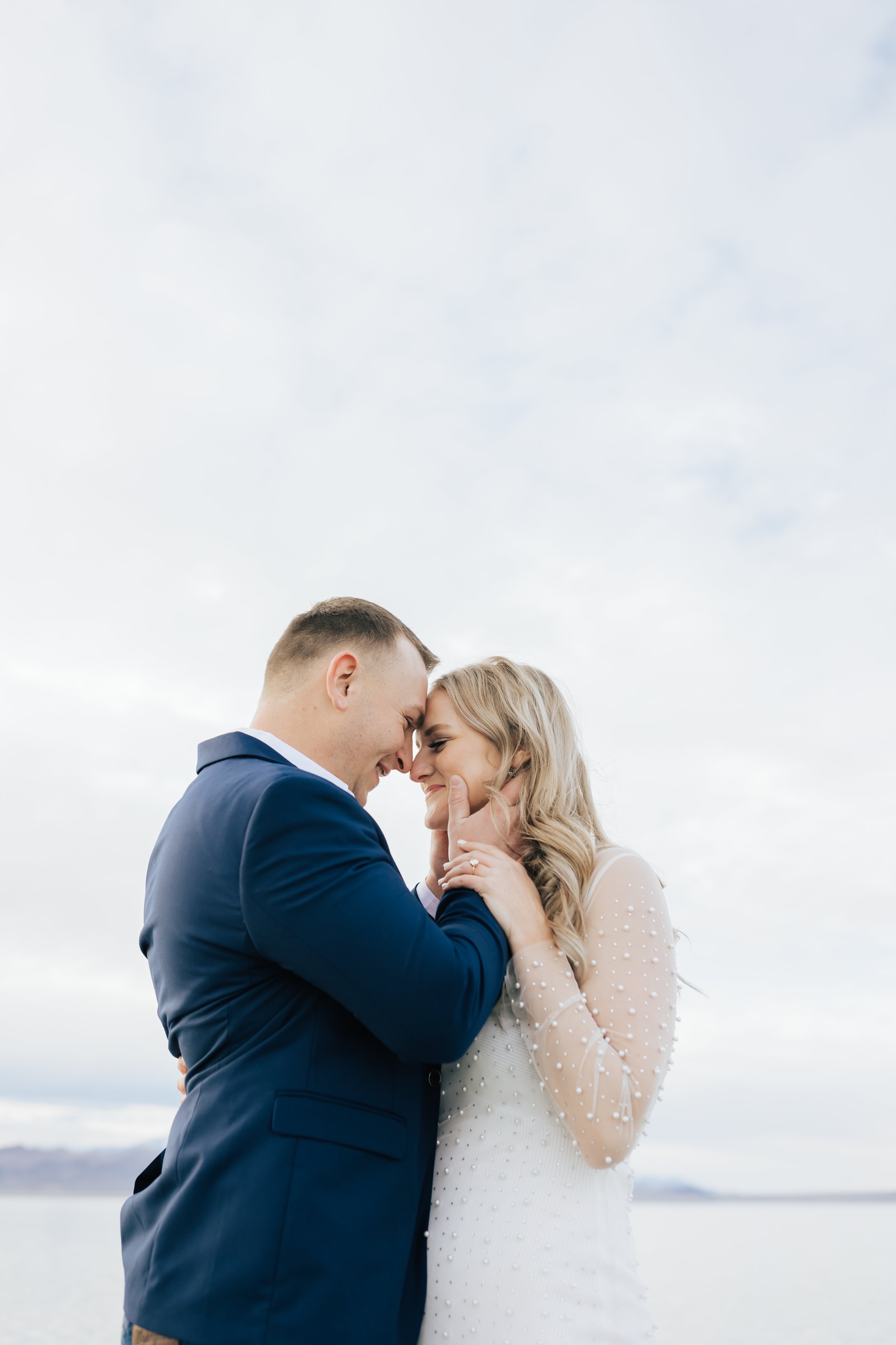  A man kisses his soon-to-be wife romantically during an engagement session with Emily Jenkins Photography in Northern UT. authentic engagements dream engagement photography Utah High-End #EmilyJenkinsPhotography #EmilyJenkinsEngagements #BonnevilleS