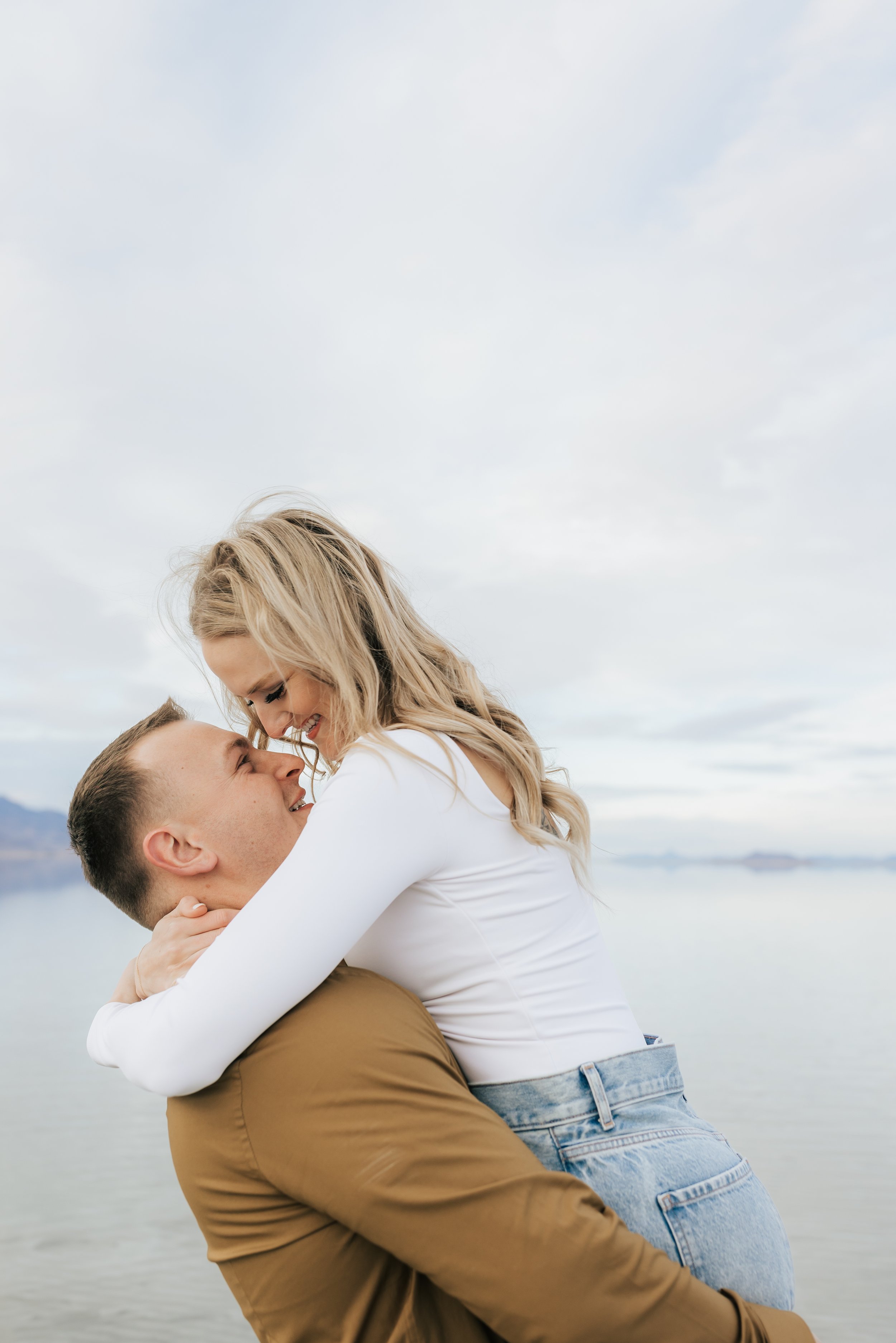  Casual summer engagements outdoors at a Utah Lake with natural editing by Emily Jenkins Photography. neutral outfit ideas for couples in love soon to be married #EmilyJenkinsPhotography #EmilyJenkinsEngagements #BonnevilleSaltFlats #SaltFlatEngageme