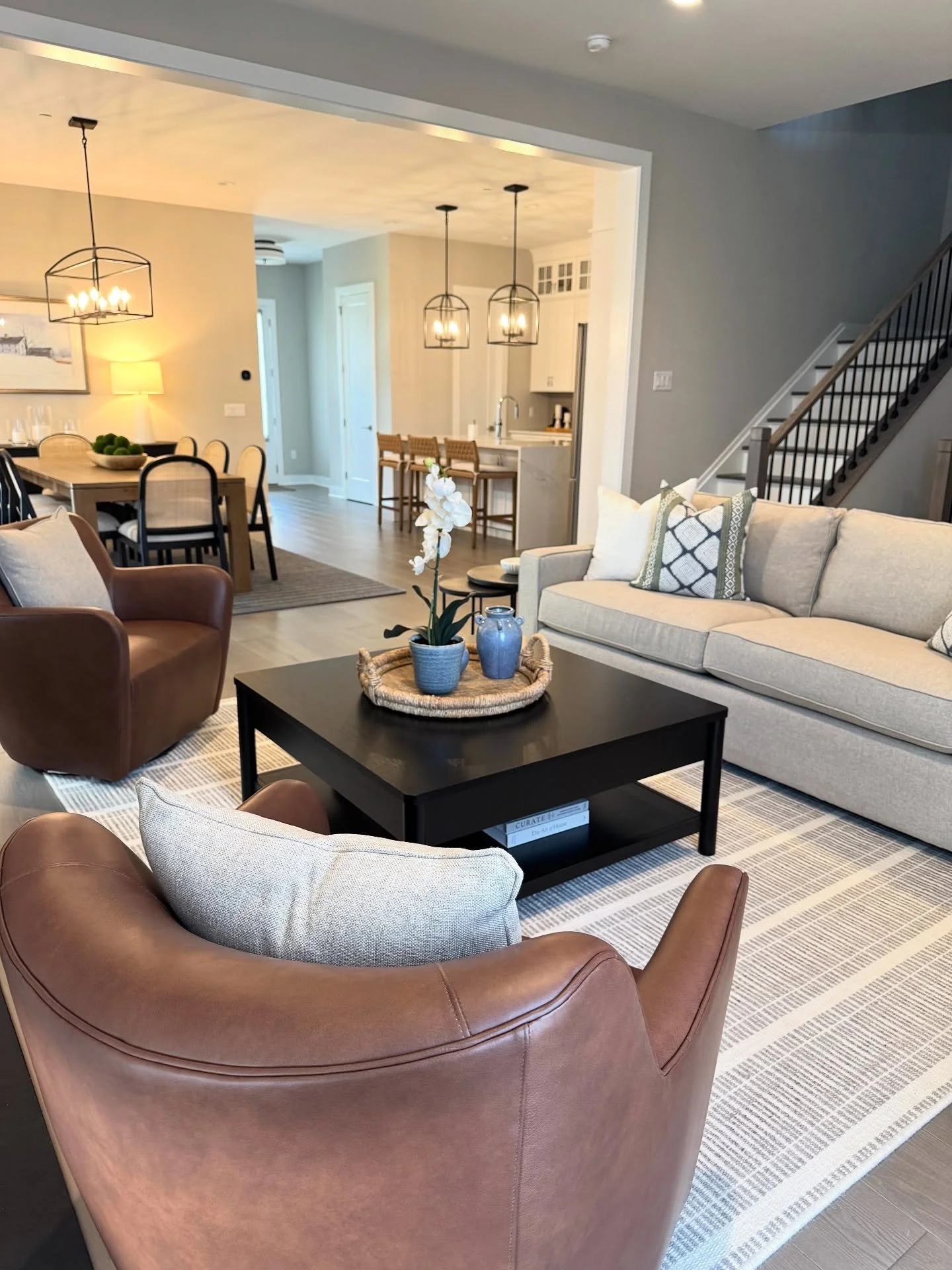 The task: leverage the foundation (paint color, wood flooring, tile and cabinetry) of this gorgeous Chappaqua new build to furnish the space to be warm and inviting for an active family. 

Neutral tones have dimension by layering textures including c