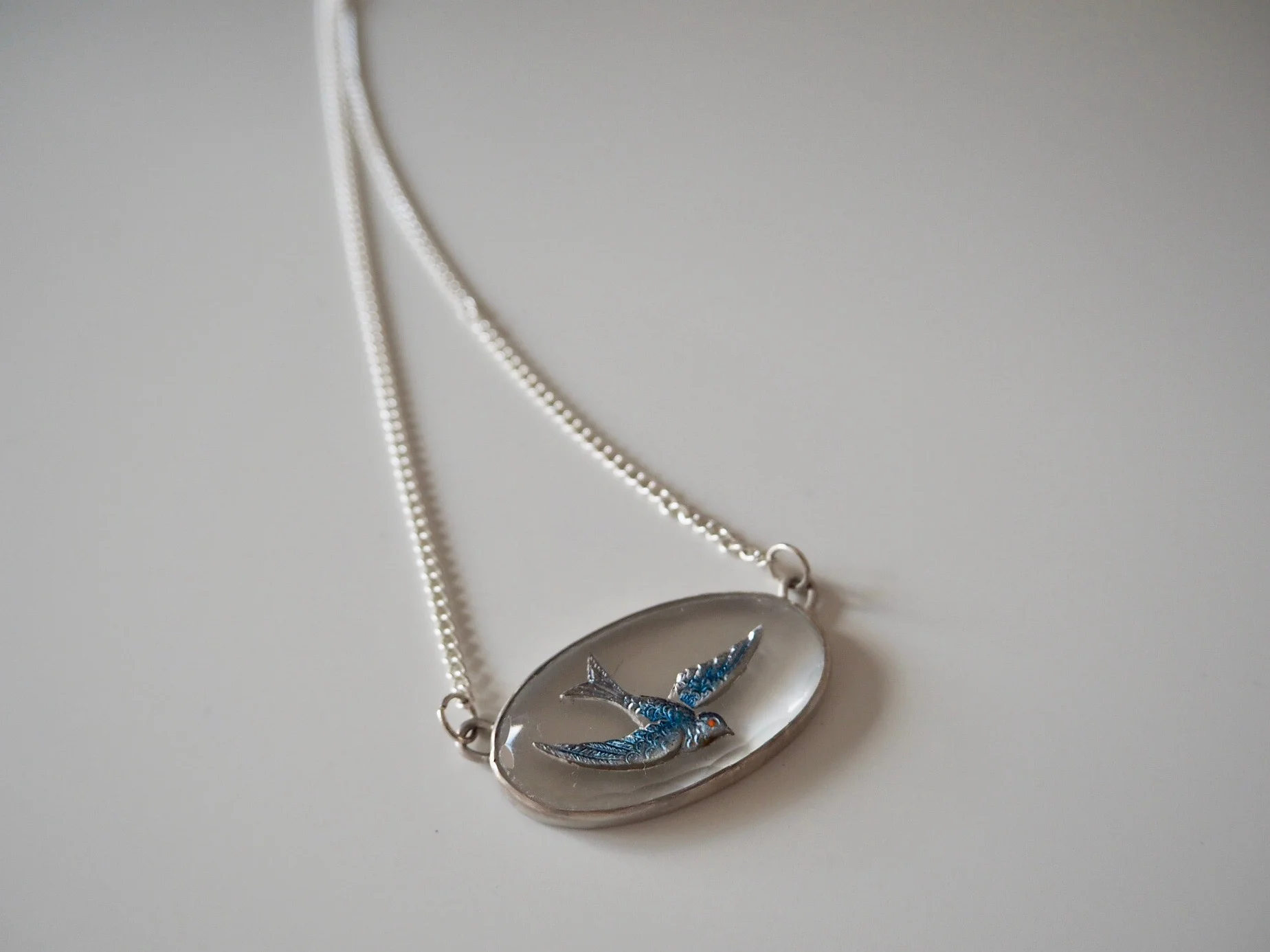 blue glass bird cabochon pendant.jpeg