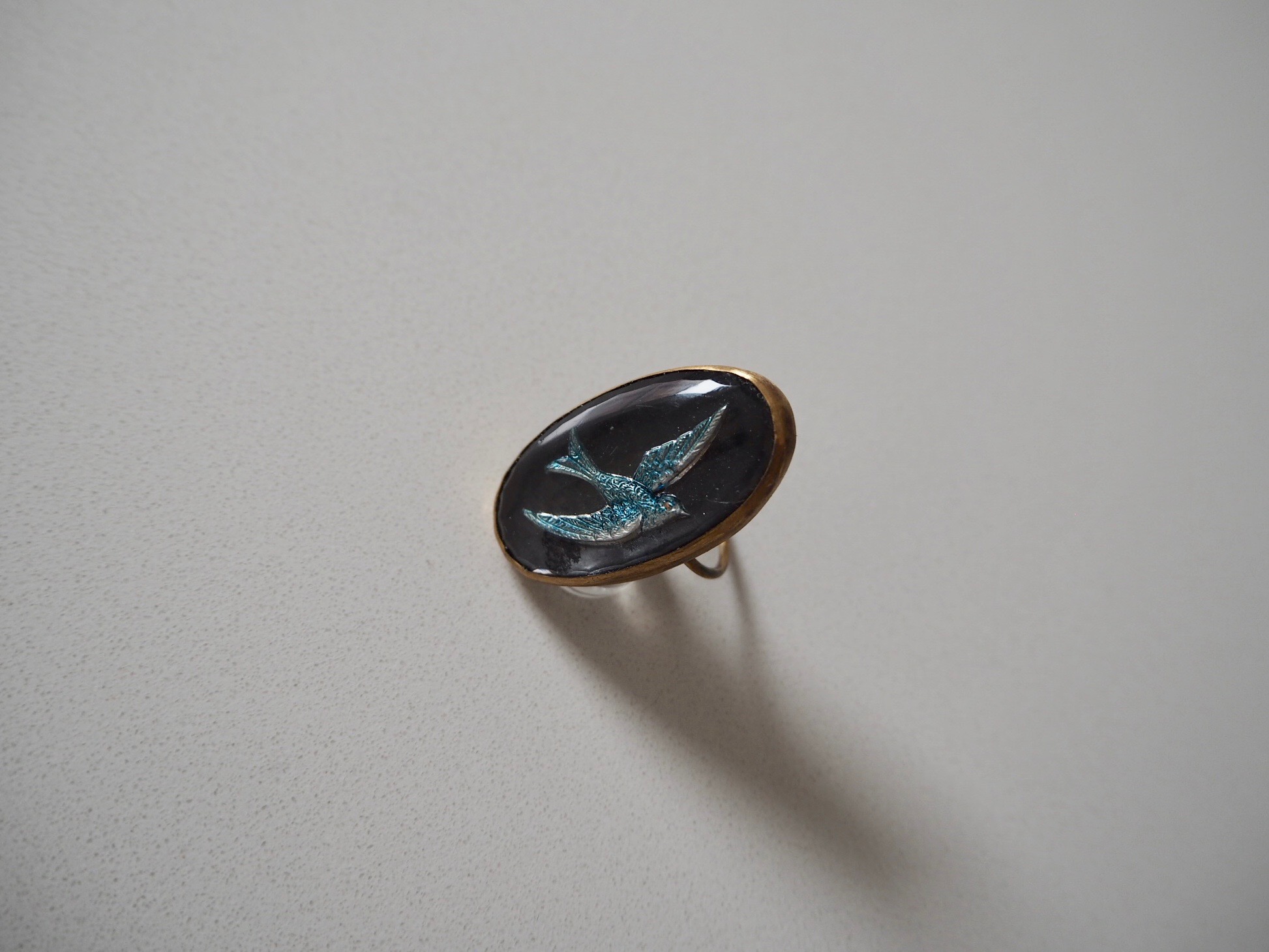blue bird glass intaglio ring.jpeg