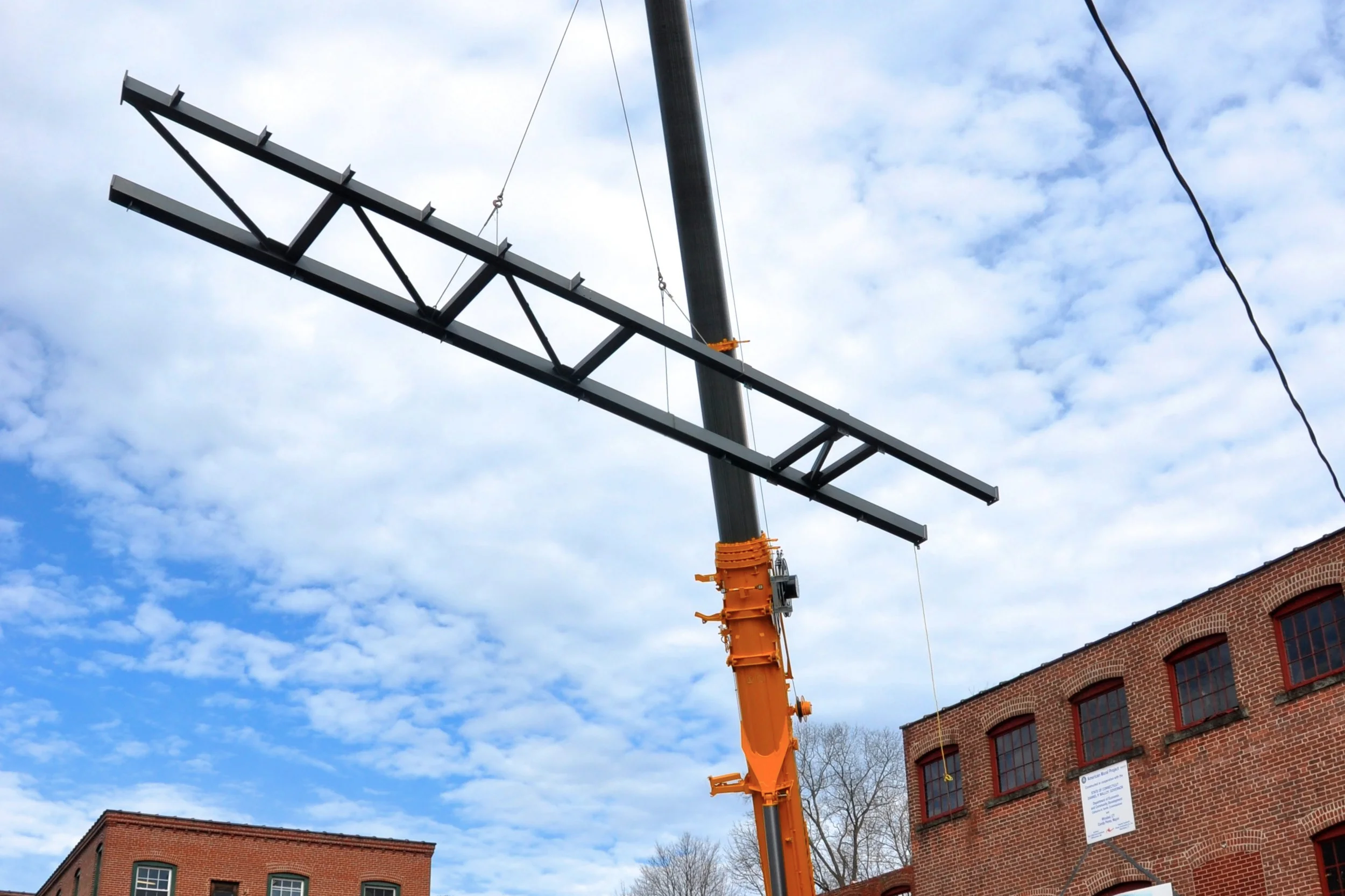 First+steel+beam+going+over+the+wall+and+into+the+mill.jpg