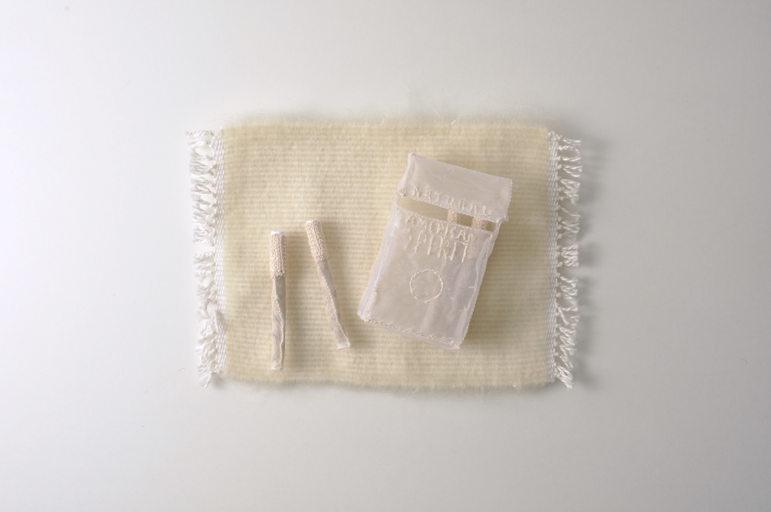 She inhaled smoke outside while he exhaled his final breath inside. silk organza, dissolvable fabric, cotton, paper, thistle seeds, mohair