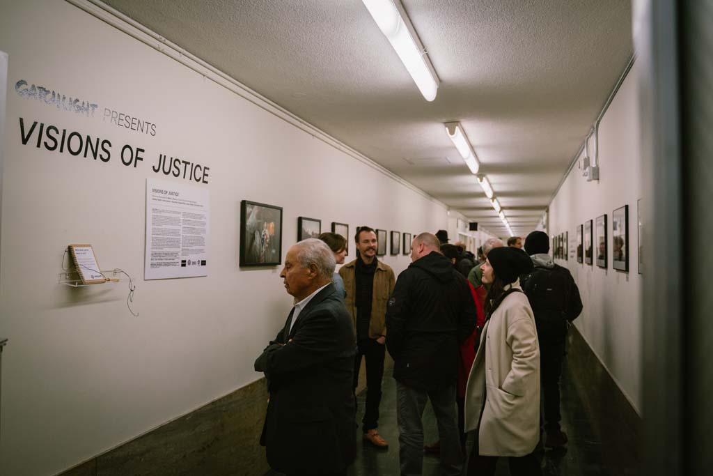 Guests check out the Visions of Justice exhibition at the Hall of Justice. Over 80 people came out to the opening of the exhibit and it will be on view through April 1, 2019.