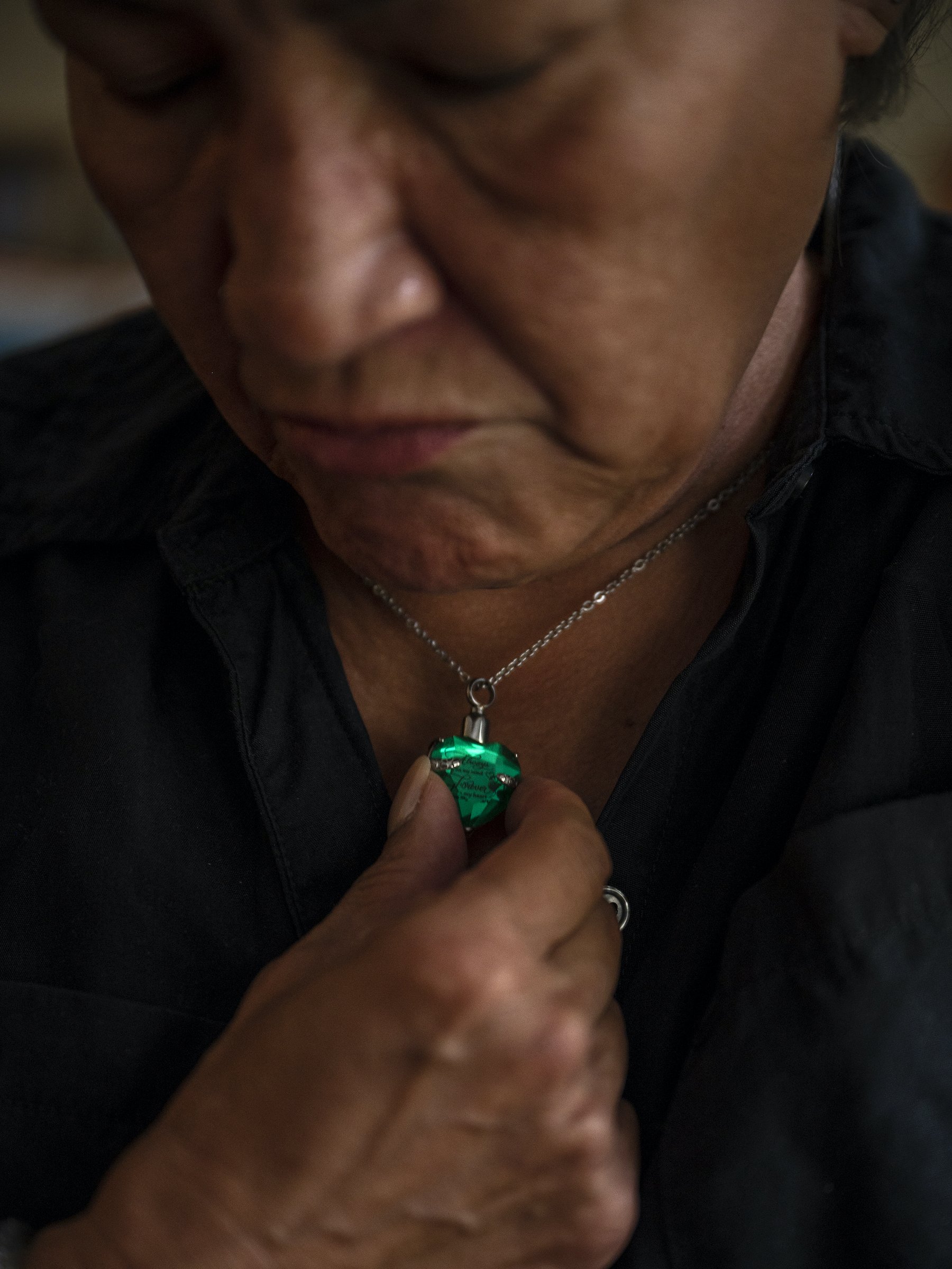  Rosario-Megibow’s pendant contains a small amount of Michael David Lopez’ ashes, photographed on Friday, July 29, 2022. Photographed for THE CITY with reporting by Reuven Blau. © Hiram Alejandro Durán 