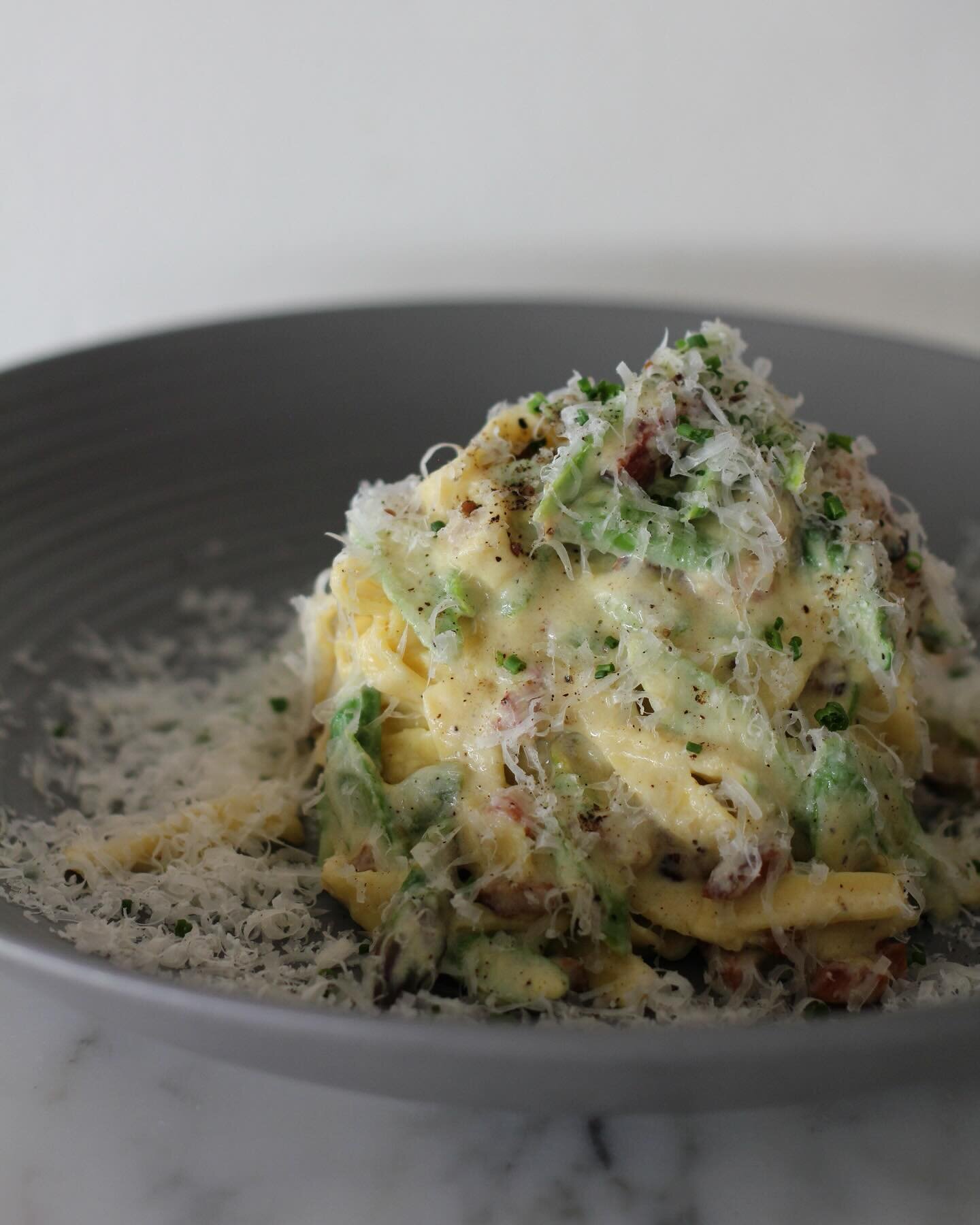 An early spring carbonara for you, featuring crispy guanciale, fresh asparagus and the creamiest noodles made with farm eggs