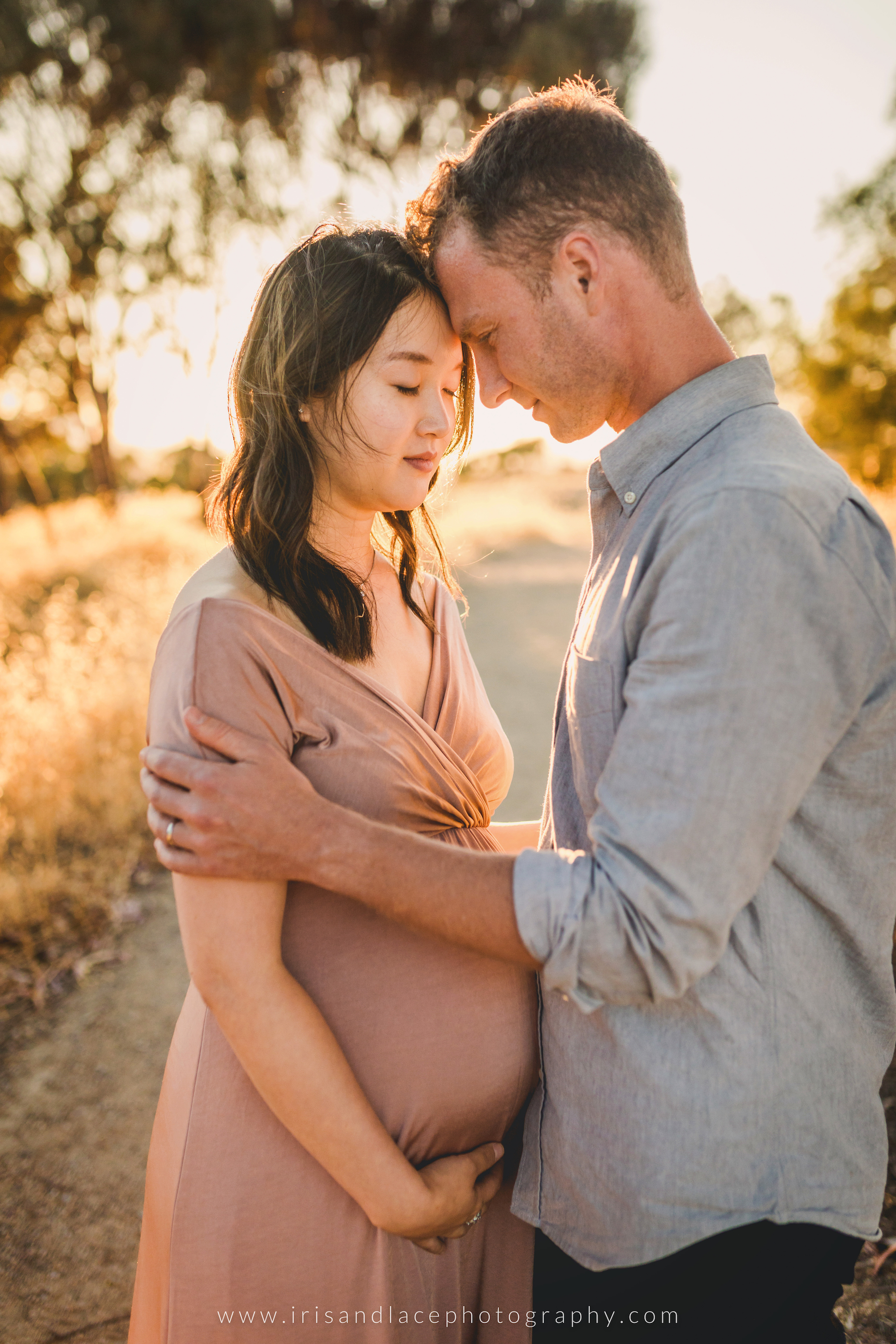 Father and Mother embrace during pregnancy photoshoot