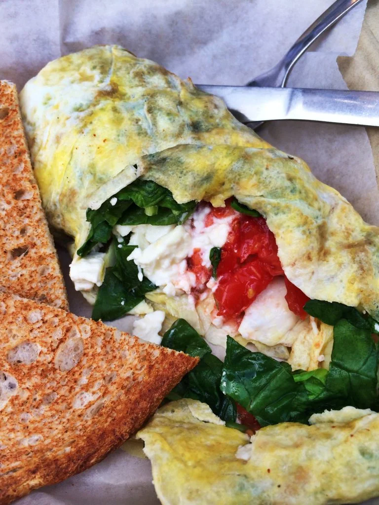 The savory “Ostara” omelette- artichoke hearts, feta cheese, spinach, and tomatoes.