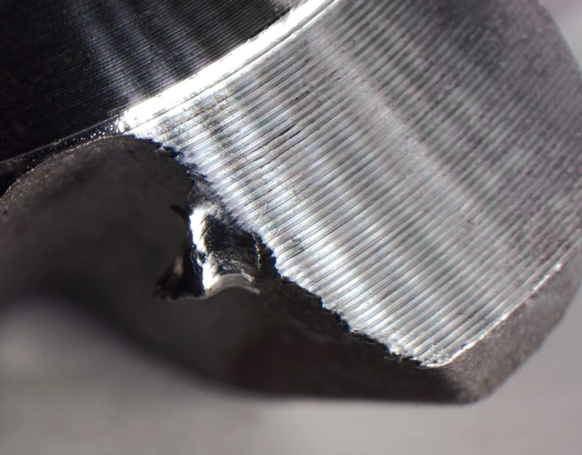 What is deburring in manufacturing?