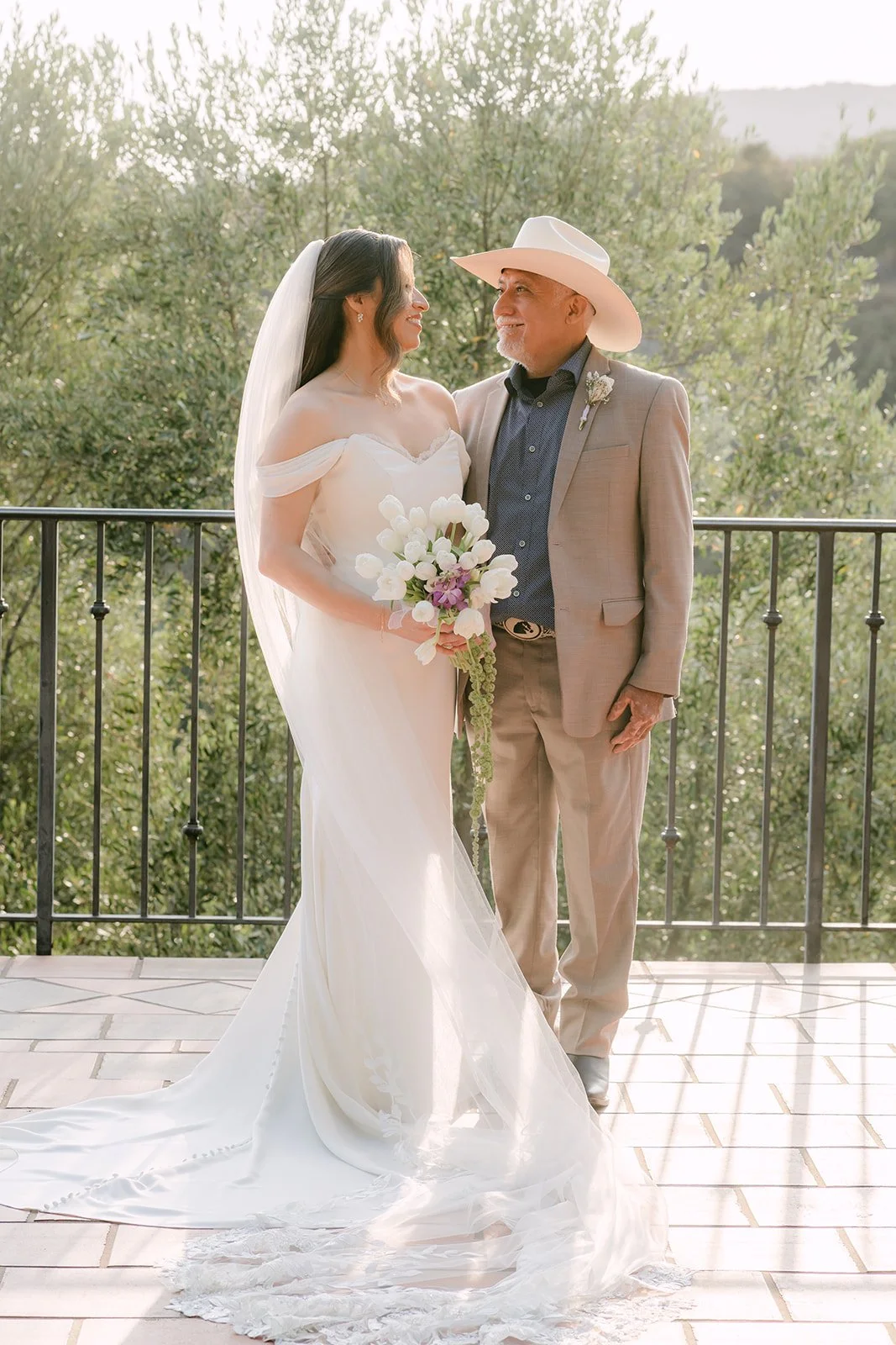 Mariana and her dad sharing a smile on the terrace