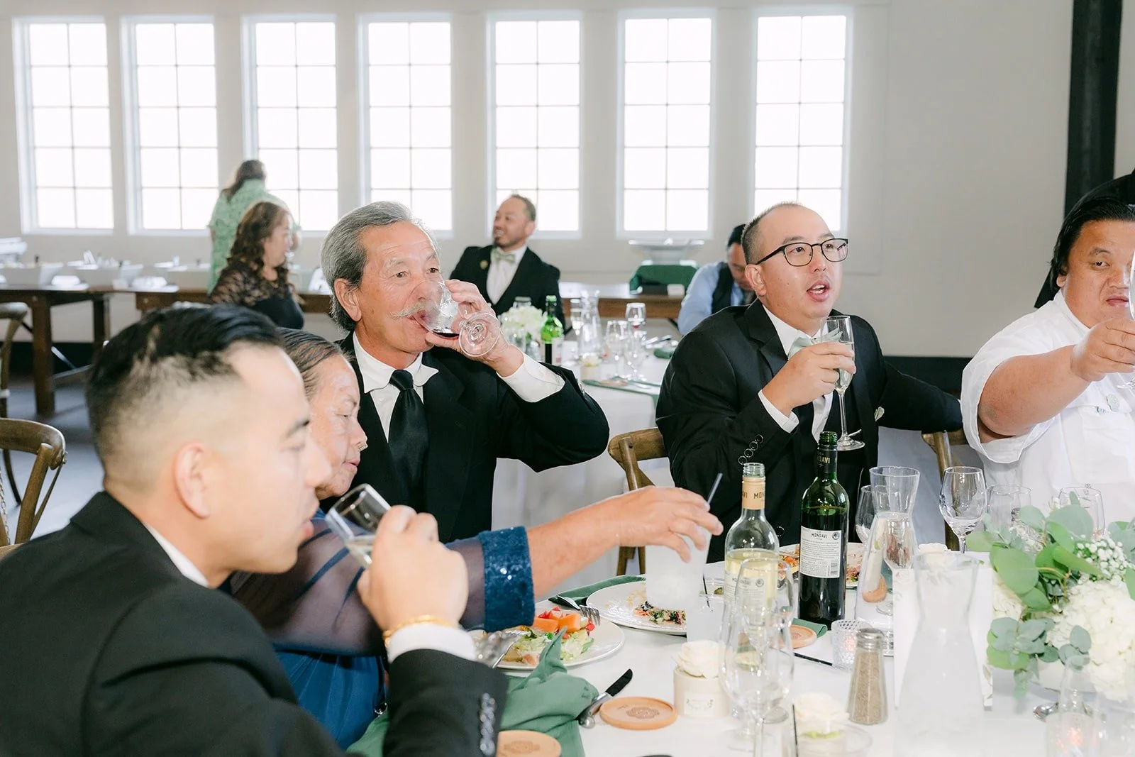 Guests toasting at their table