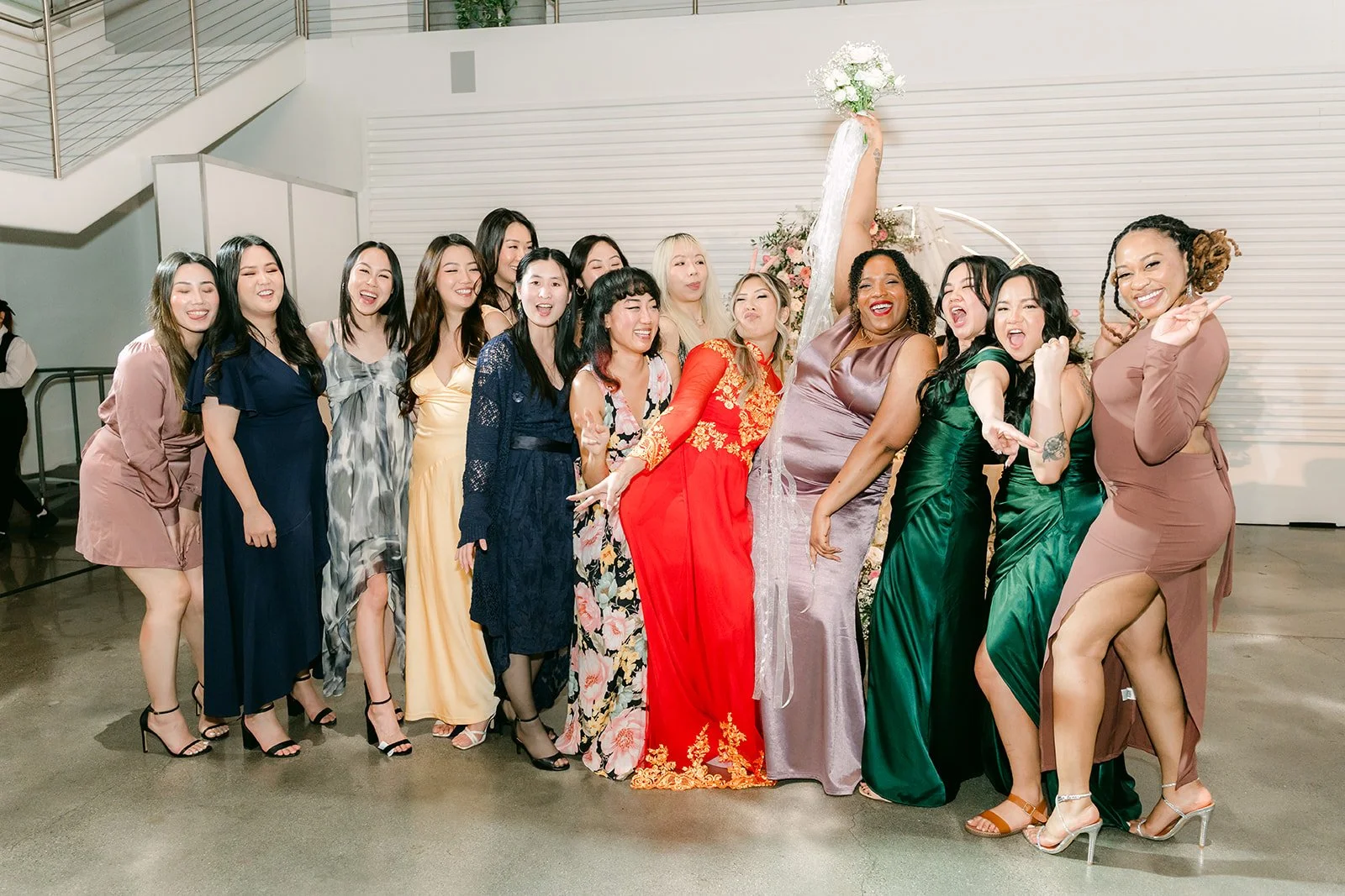 Bouquet toss winner celebrating with friends