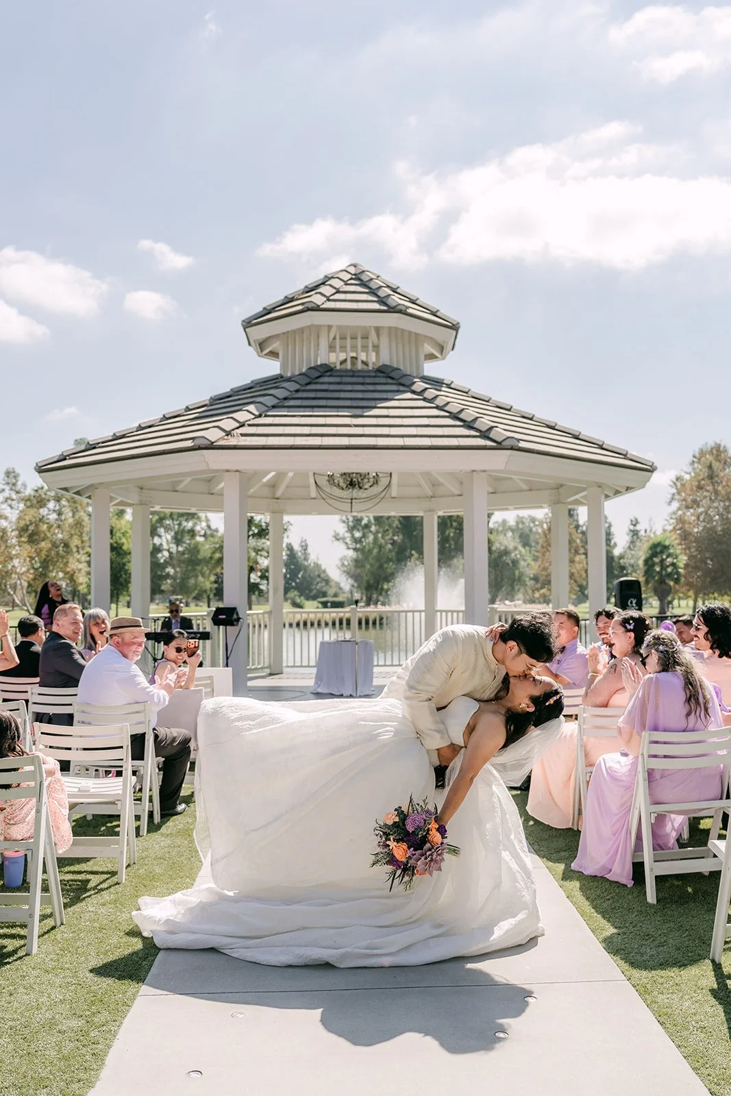 A dip kiss at the end of the aisle