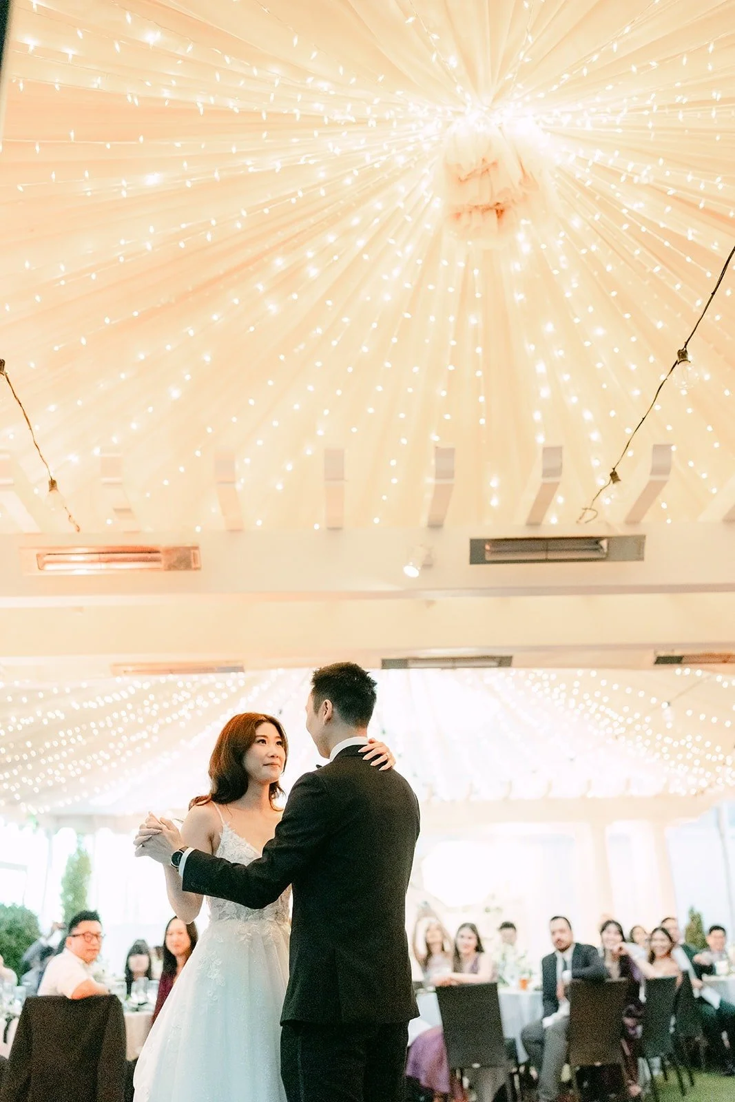 Valerie and Jason's first dance beneath the glowing canopy at Five Crowns