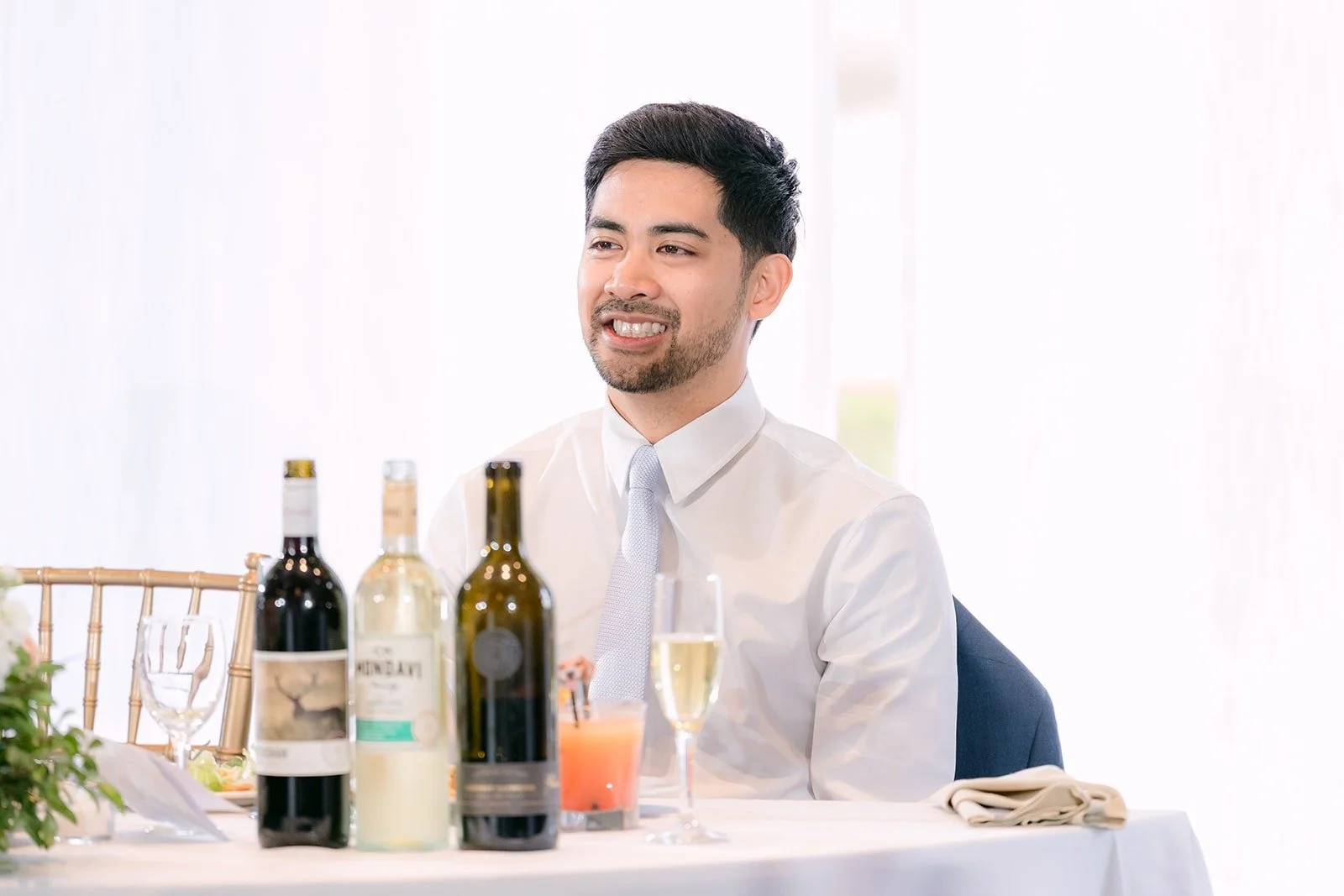 Mark laughing at the sweetheart table during the speeches