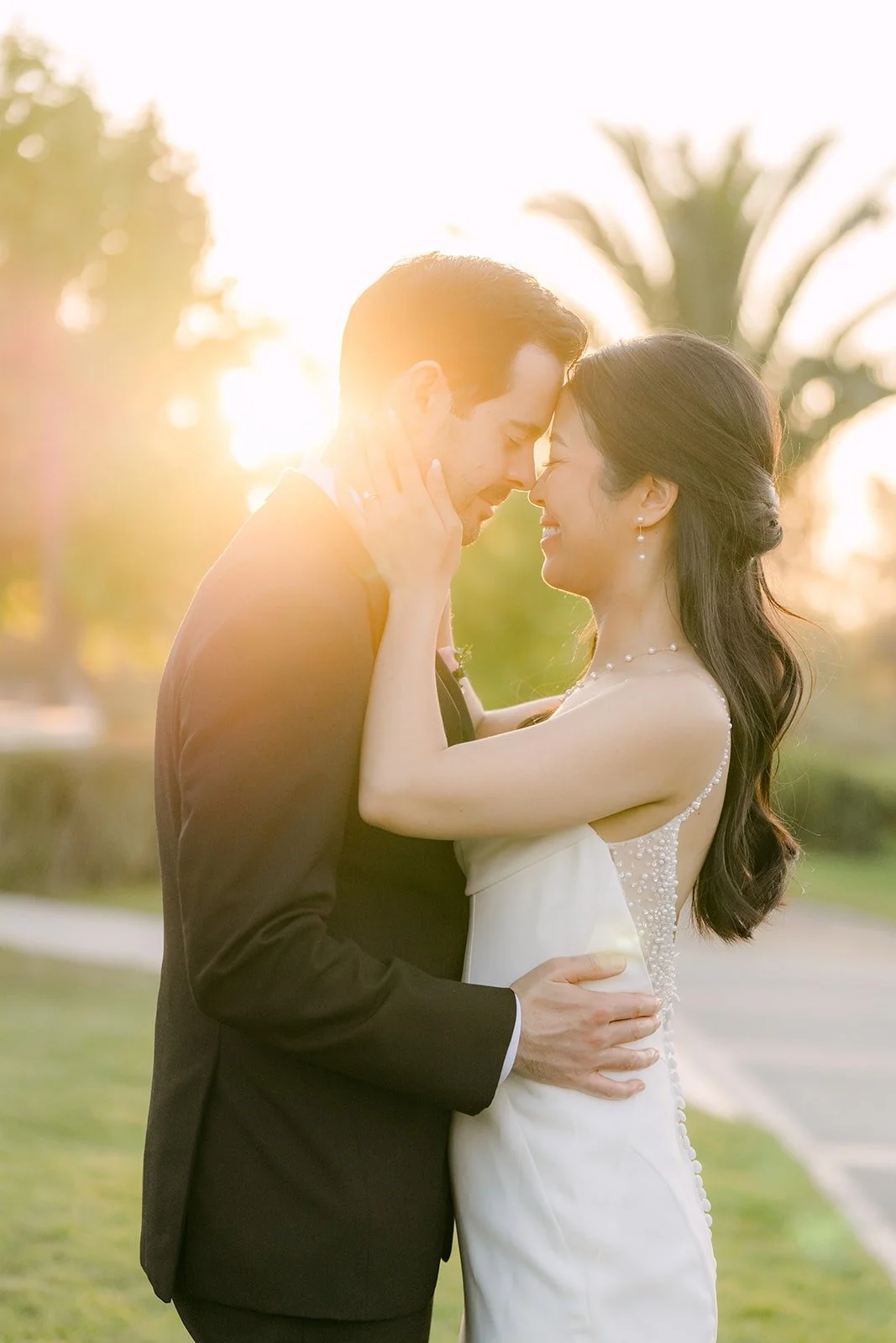 Stephanie and Kevin embracing in golden hour light at Sterling Hills
