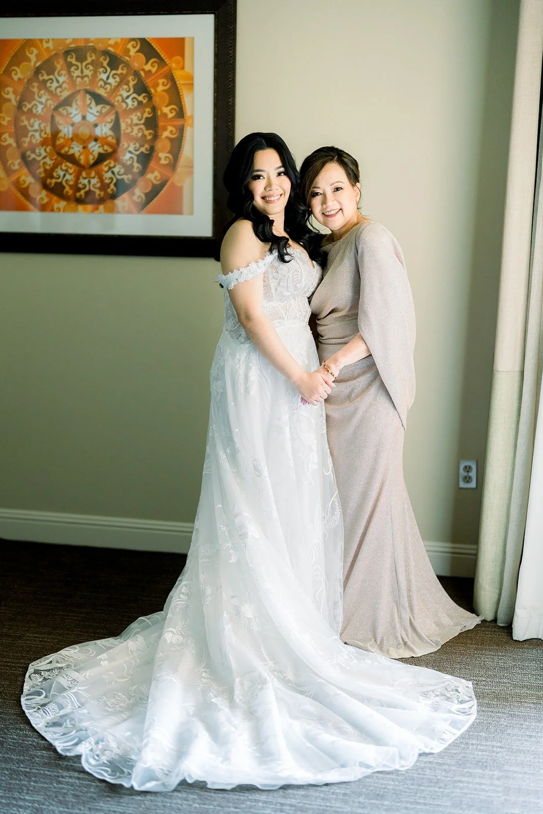 Francesca and a family member sharing a hug before the ceremony, photographed by One and Only Production