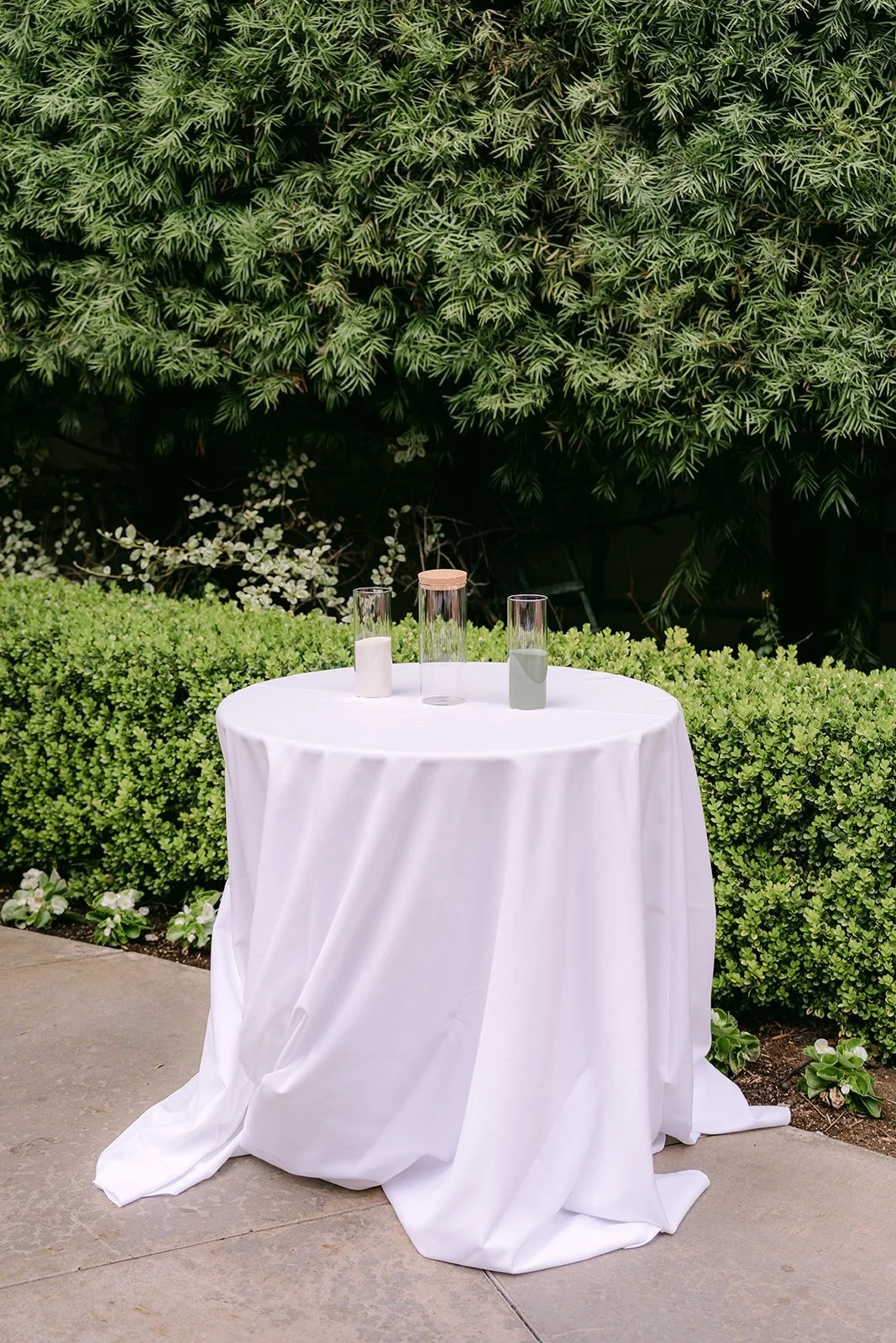 A small round table set for the sand ceremony