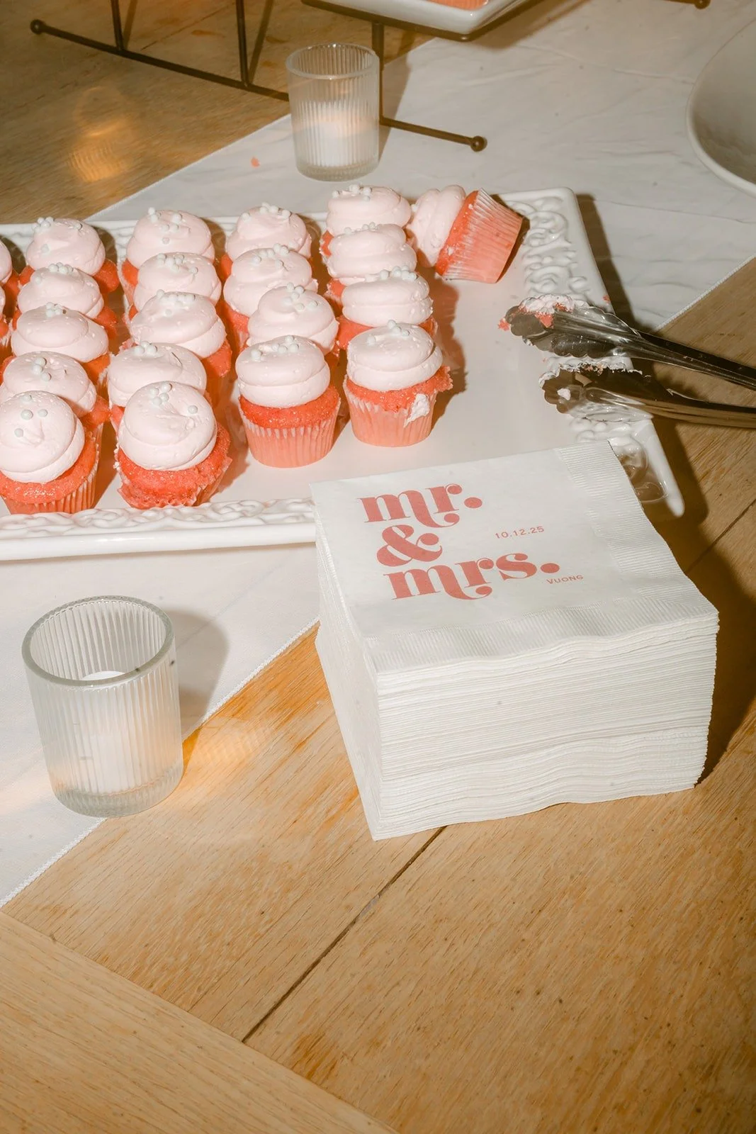 Cupcakes beside mr and mrs napkins