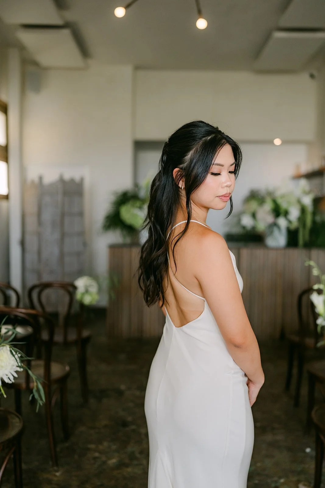 Justine showing off the open back of her gown