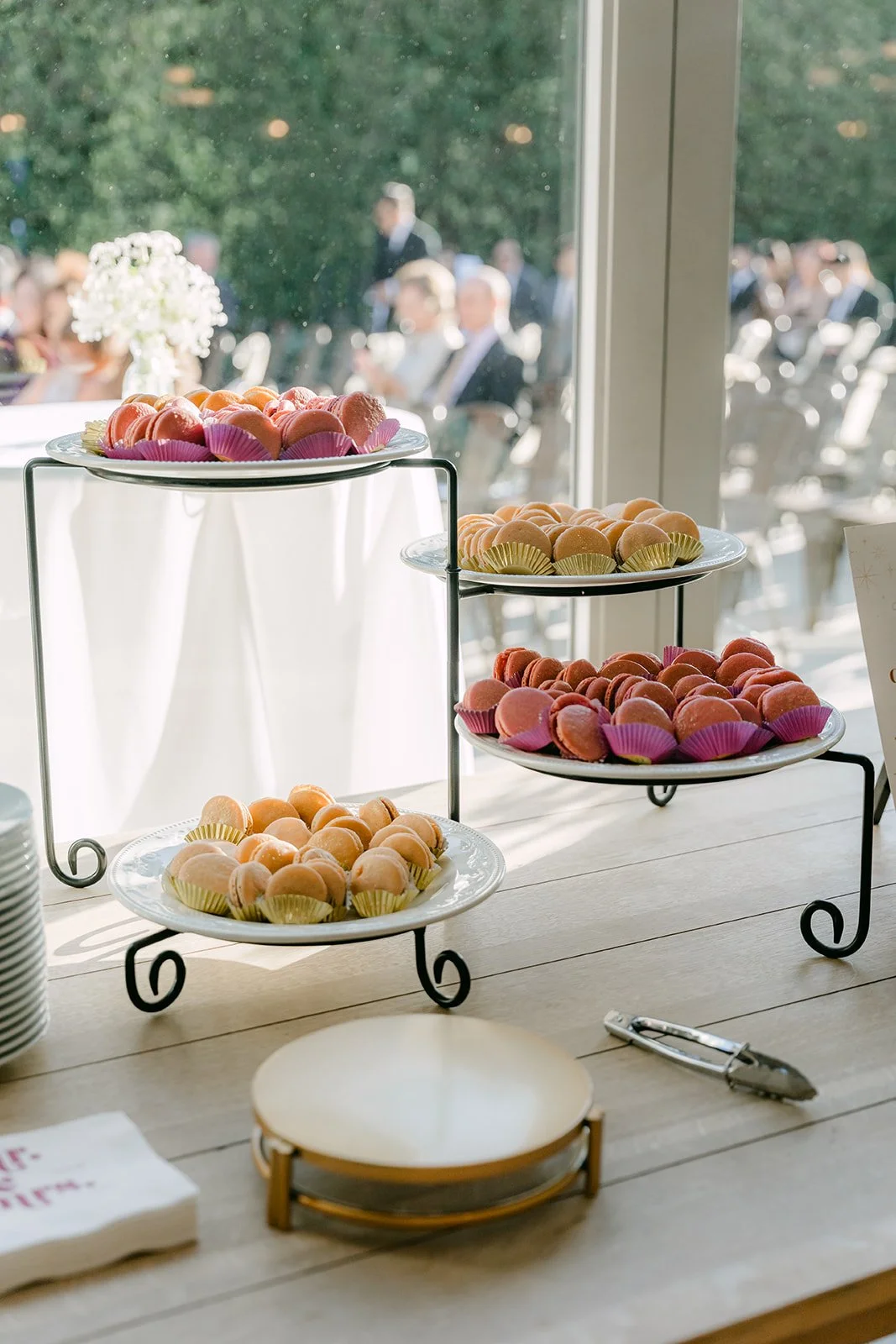 Dessert table with cream puffs and cupcakes