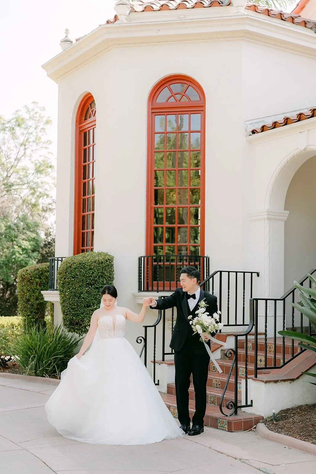 Amy and Sam walking past the mansion's corner tower