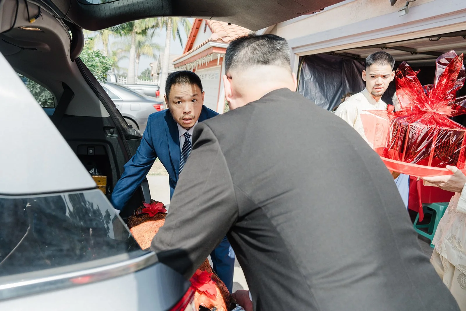Unloading gift trays from the car.