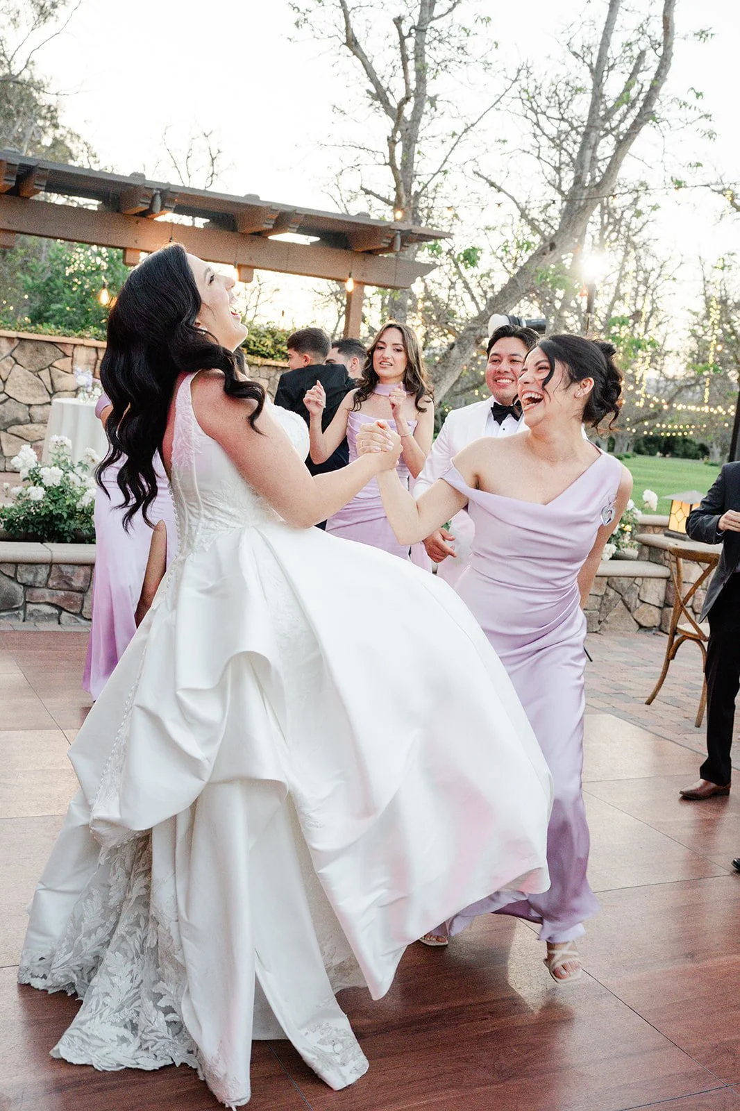 Bride dancing with her bridesmaids