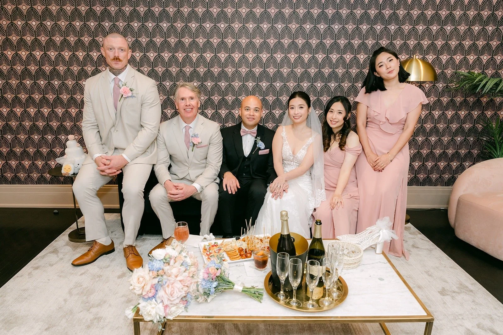The wedding party relaxes together in the lounge at The Headquarters