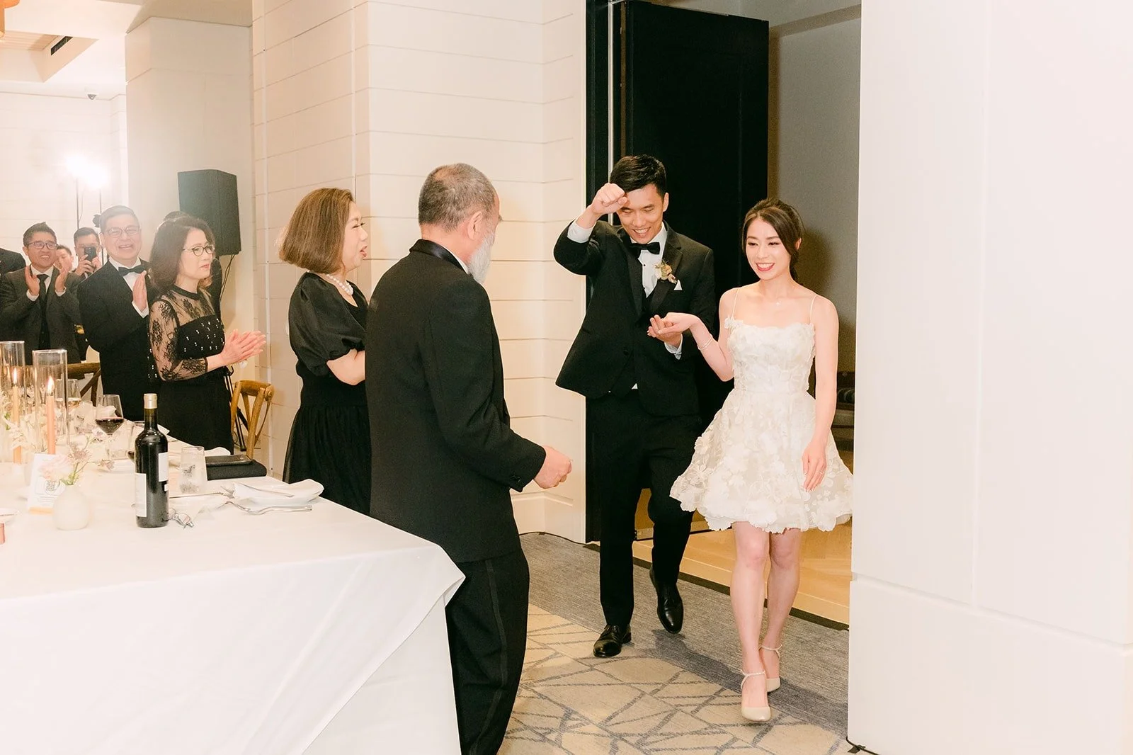 Angela and Eli making their grand entrance into the reception