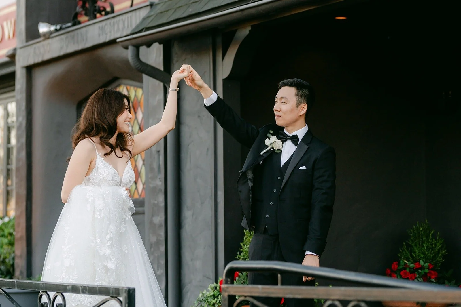 Jason twirling Valerie on the porch, photographed by One and Only Production