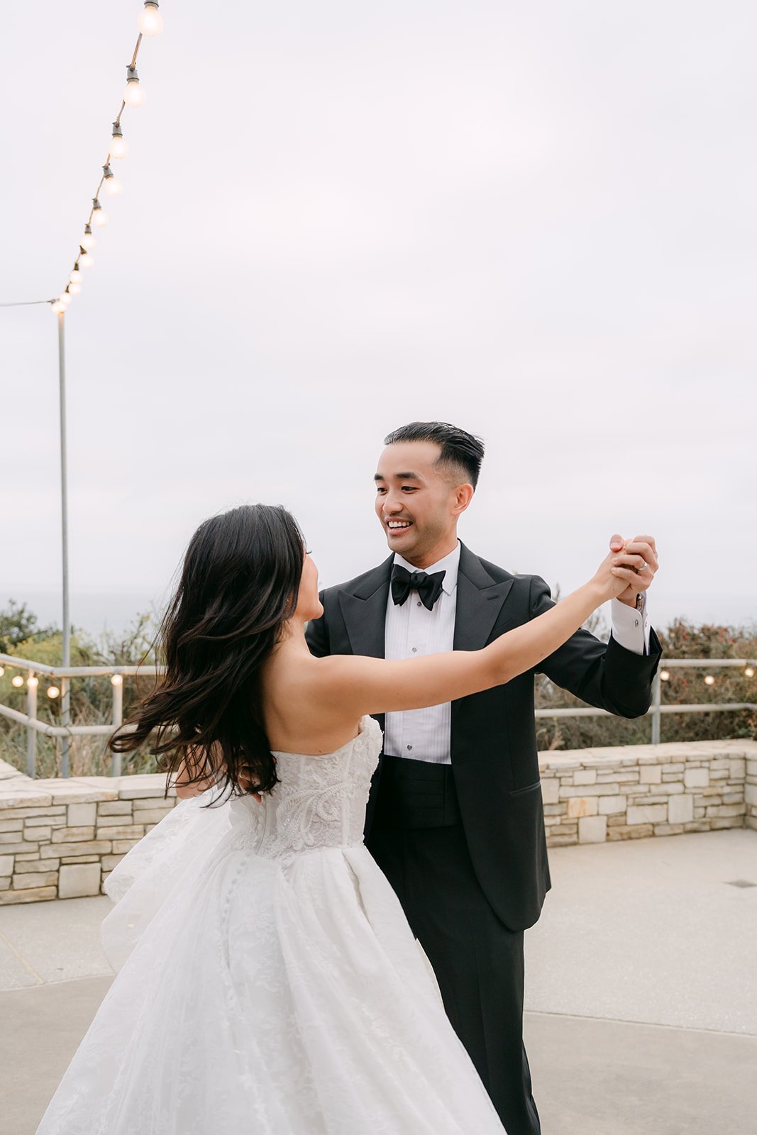 Kim and Vincent smiling at the end of their first dance