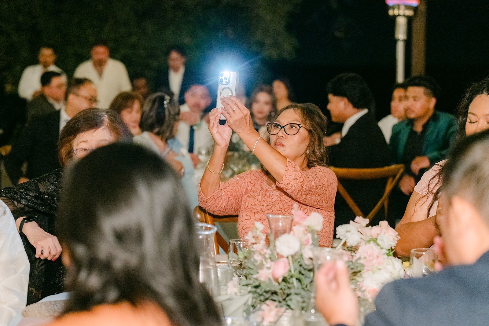 Guests raising their glasses for a toast